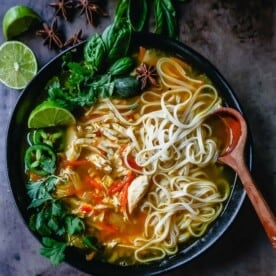 Quick and Easy Chicken Pho with tender chicken, warm broth, garlic, ginger, spices, fresh vegetables, and a touch of spice. This is a version of the popular Vietnamese Chicken Pho soup.