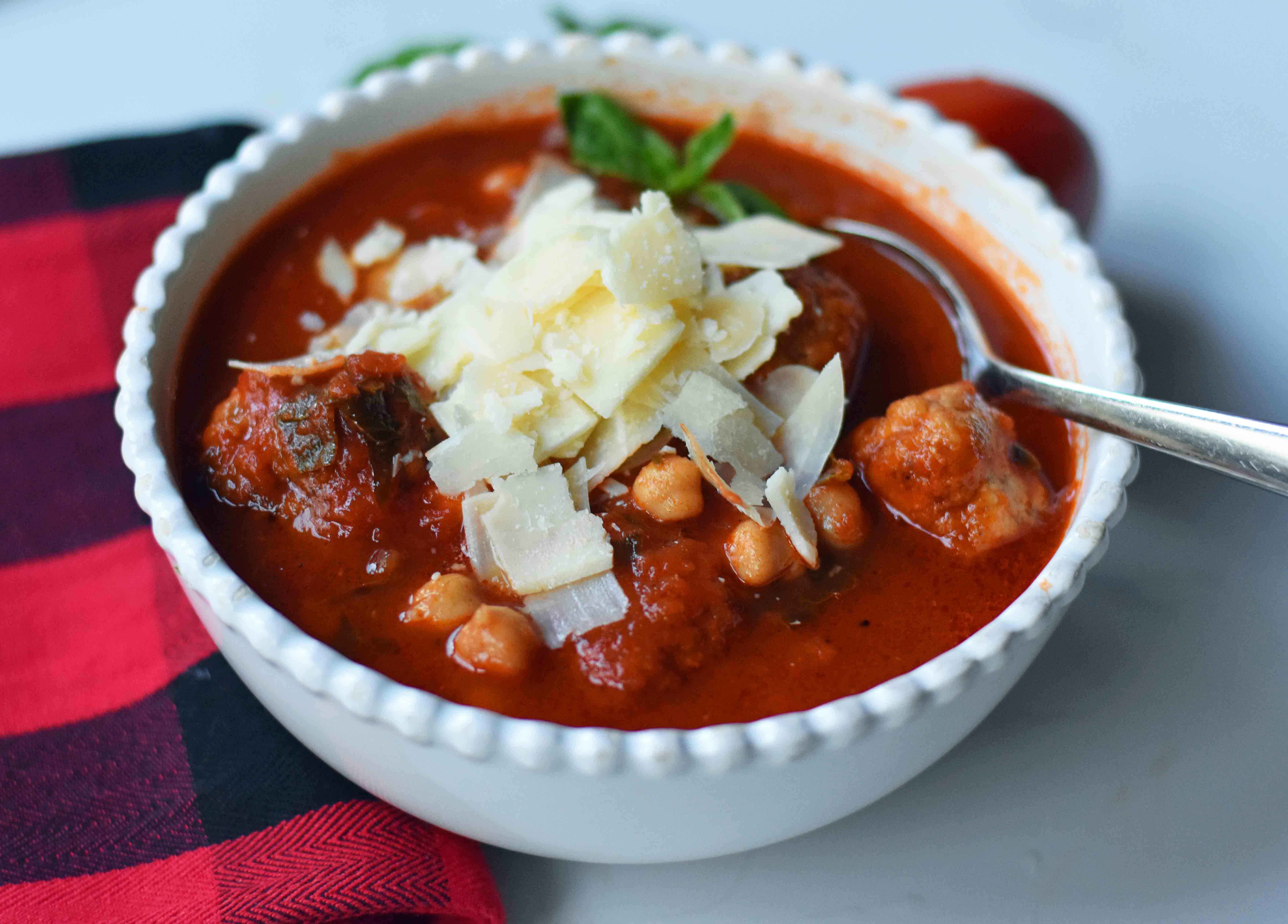 Mama Mia Spicy Turkey Meatball Soup. Healthy, gluten-free soup made with spicy turkey meatballs, marinara sauce, chicken broth, garbanzo beans, fresh basil, and parmesan cheese. A flavorful and filling low-fat healthy soup recipe. www.modernhoney.com