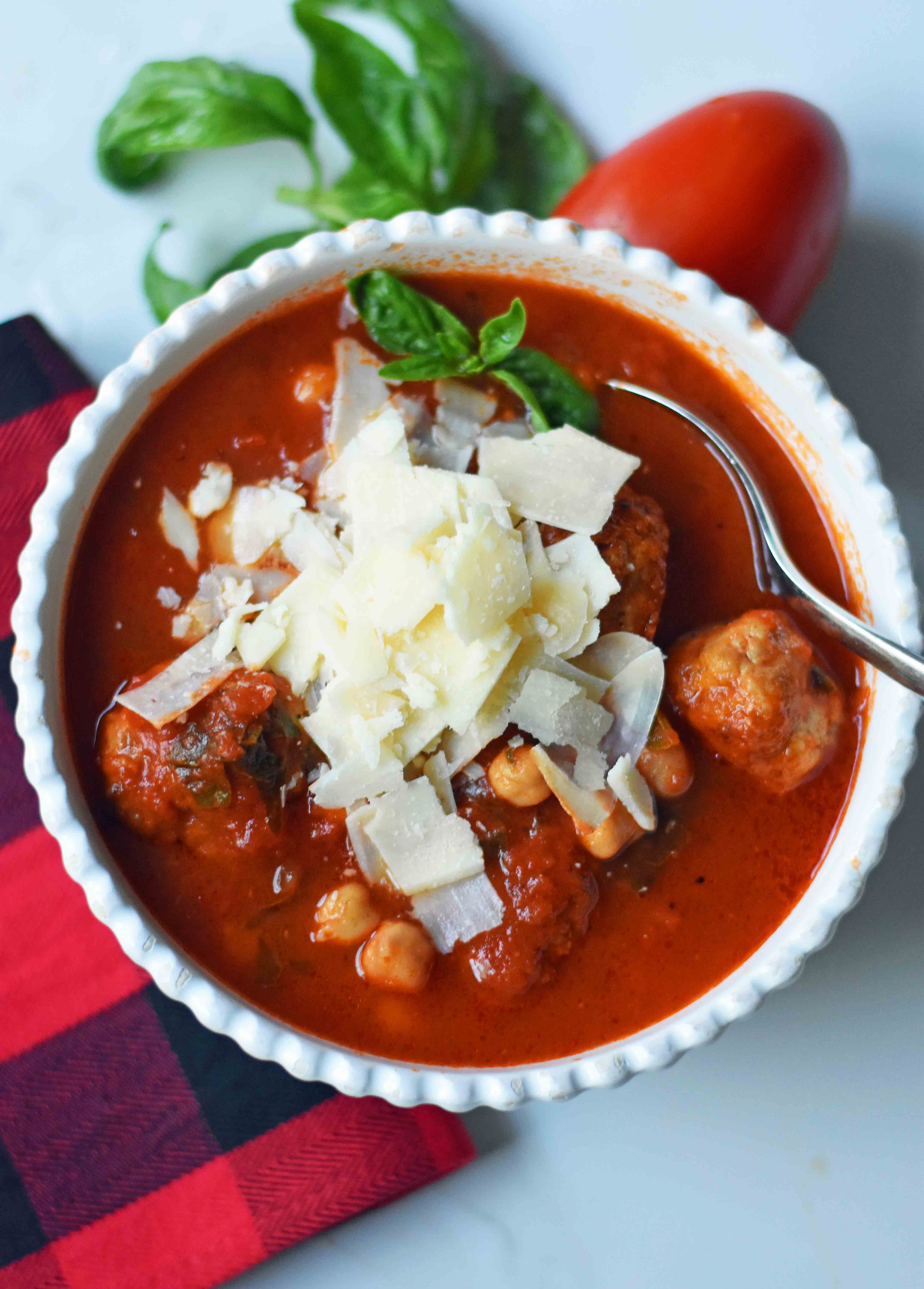 Mama Mia Spicy Turkey Meatball Soup. Healthy, gluten-free soup made with spicy turkey meatballs, marinara sauce, chicken broth, garbanzo beans, fresh basil, and parmesan cheese. A flavorful and filling low-fat healthy soup recipe. www.modernhoney.com