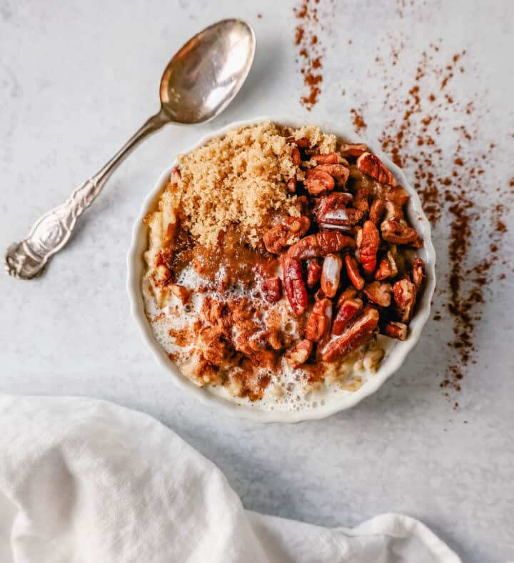 Pumpkin Spice Pecan Oatmeal. How to make creamy oatmeal with your favorite toppings combinations. I am sharing a list of all of the popular oatmeal toppings ideas to serve on a cold winter day and how to make the best bowl of oatmeal!