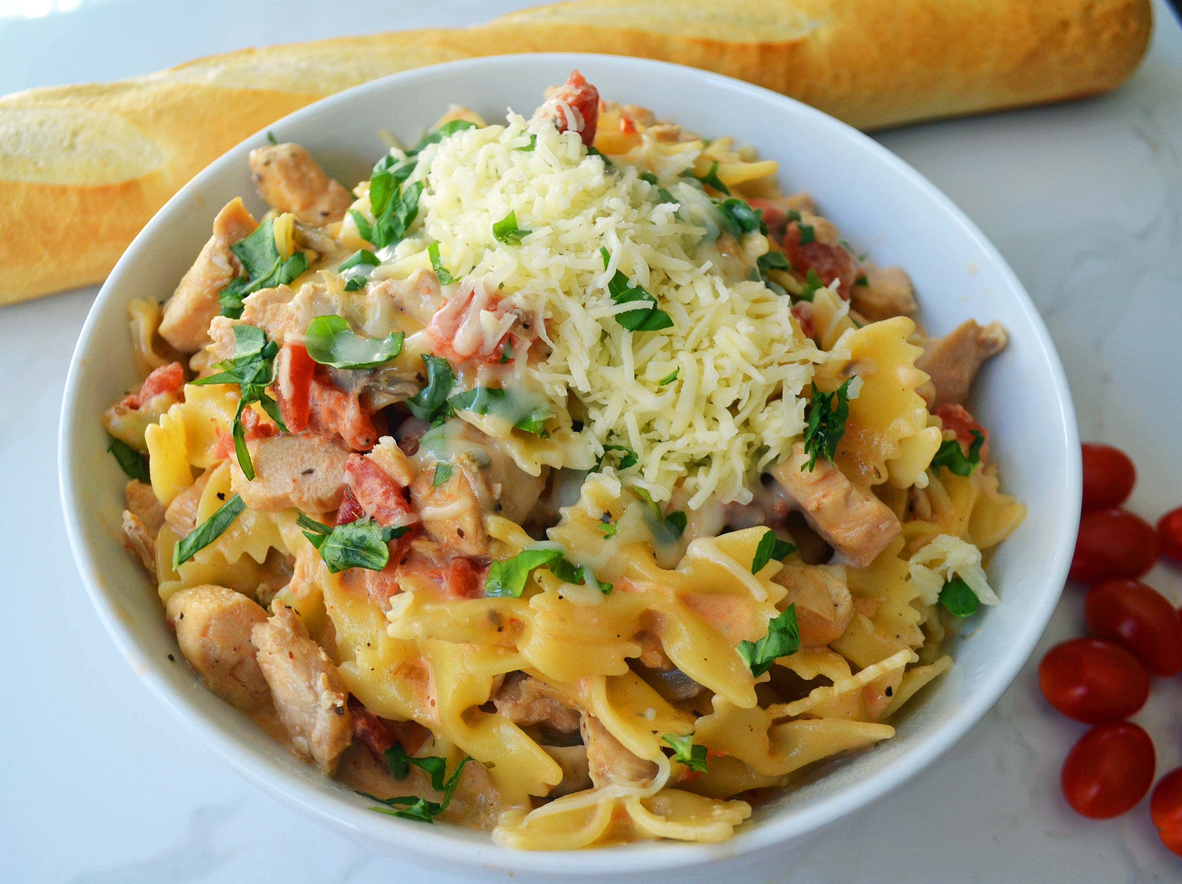 All Dressed Up Bowtie Chicken Pasta. Sauteed Chicken, Artichokes, Roasted Tomatoes, Heavy Cream, Fresh Basil, and Parmesan Cheese all tossed with Bowtie Pasta. Modern Honey - www.modernhoney.com