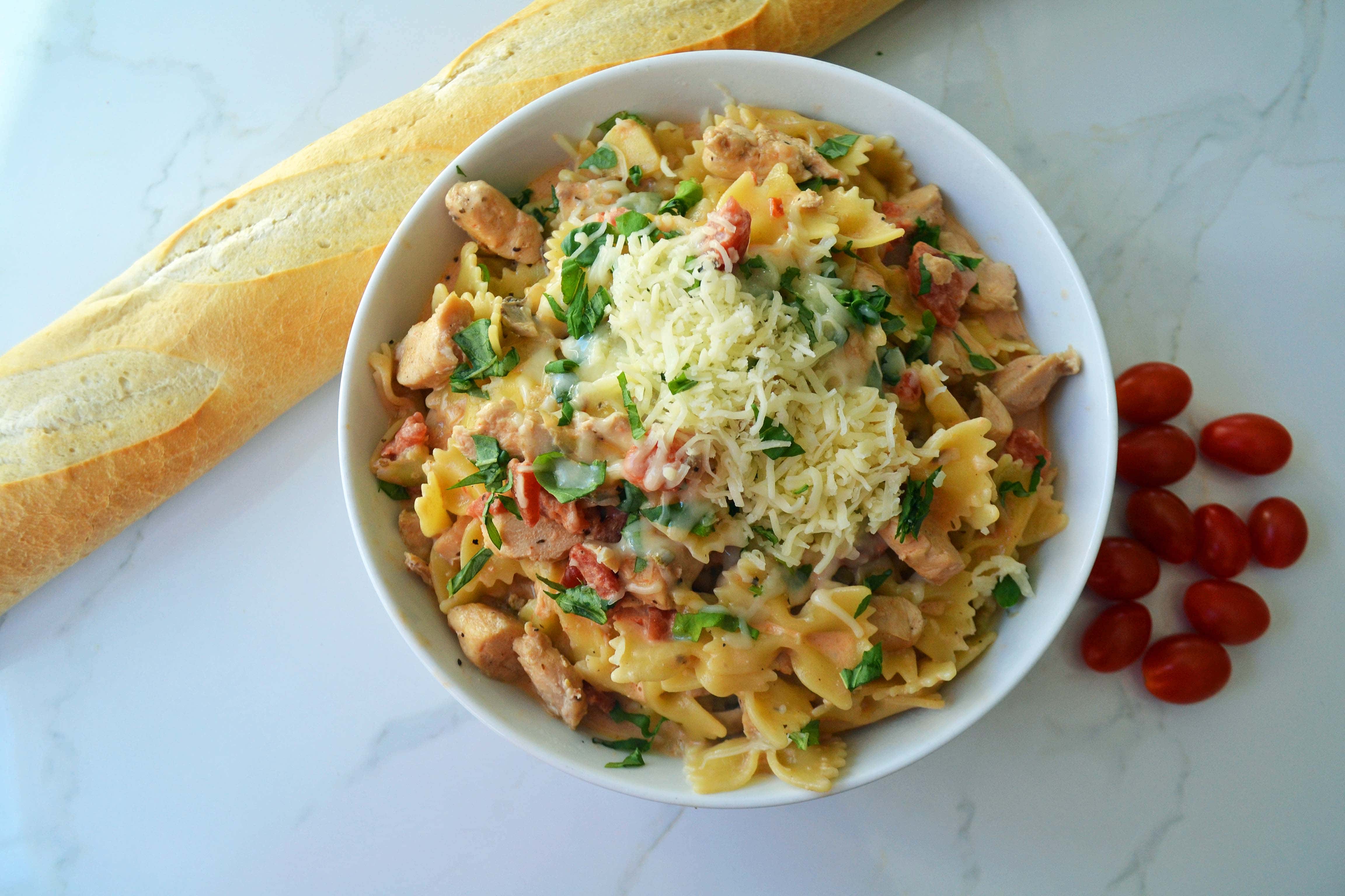 All Dressed Up Bowtie Chicken Pasta. Sauteed Chicken, Artichokes, Roasted Tomatoes, Heavy Cream, Fresh Basil, and Parmesan Cheese all tossed with Bowtie Pasta. Modern Honey - www.modernhoney.com