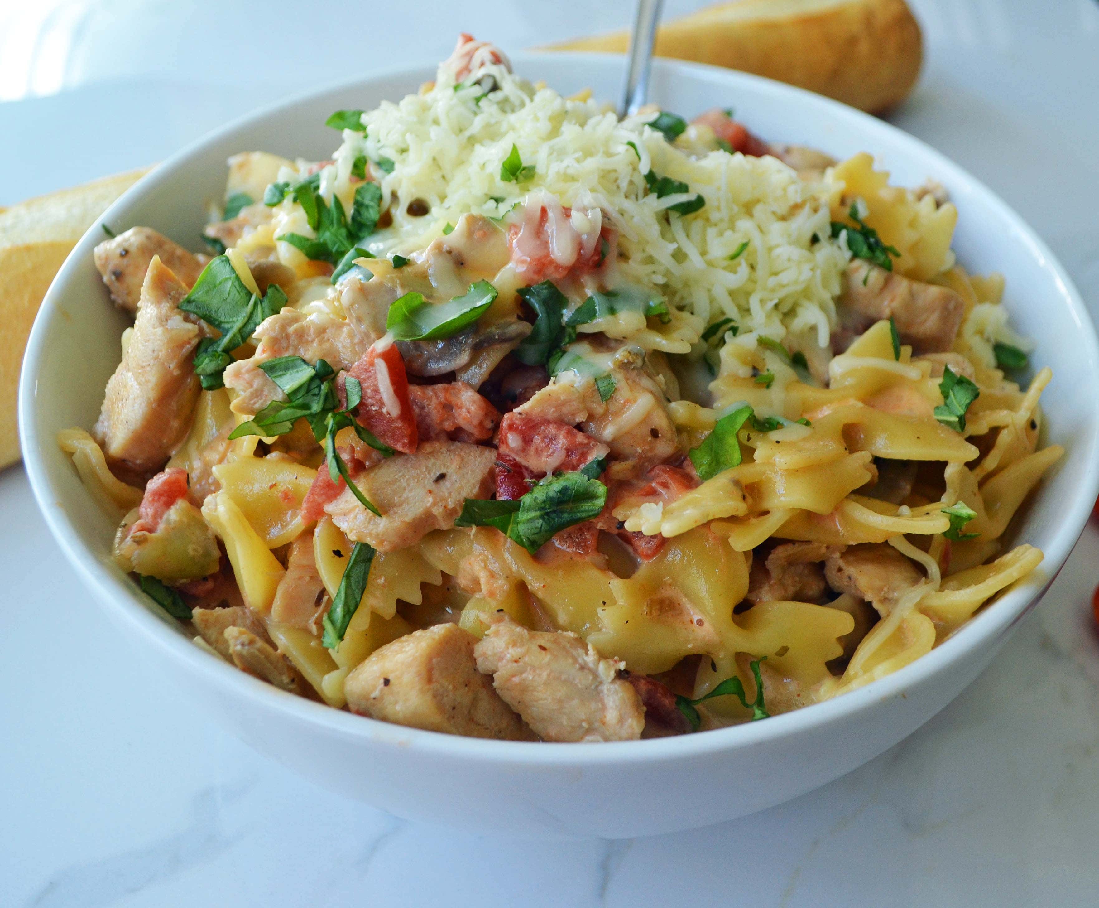 All Dressed Up Bowtie Chicken Pasta. Sauteed Chicken, Artichokes, Roasted Tomatoes, Heavy Cream, Fresh Basil, and Parmesan Cheese all tossed with Bowtie Pasta. Modern Honey - www.modernhoney.com