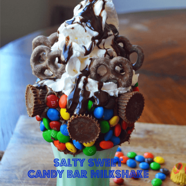 Black Tap Milkshakes Copycat Recipe. Salty Sweet Candy Bar Milkshake made with Vanilla Ice Cream, M & M's, Peanut Butter Cups, Chocolate Covered Pretzels, Hot Fudge, and Whipped Cream. www.modernhoney.com