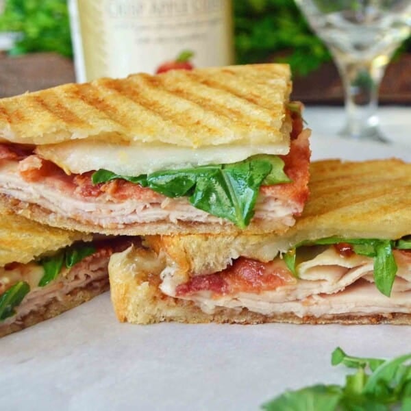 Turkey Bacon Panini with turkey, creamy havarti cheese, crispy bacon, fig spread, arugula, all on a buttered toasted bread. The perfect turkey bacon sandwich! www.modenrhoney.com