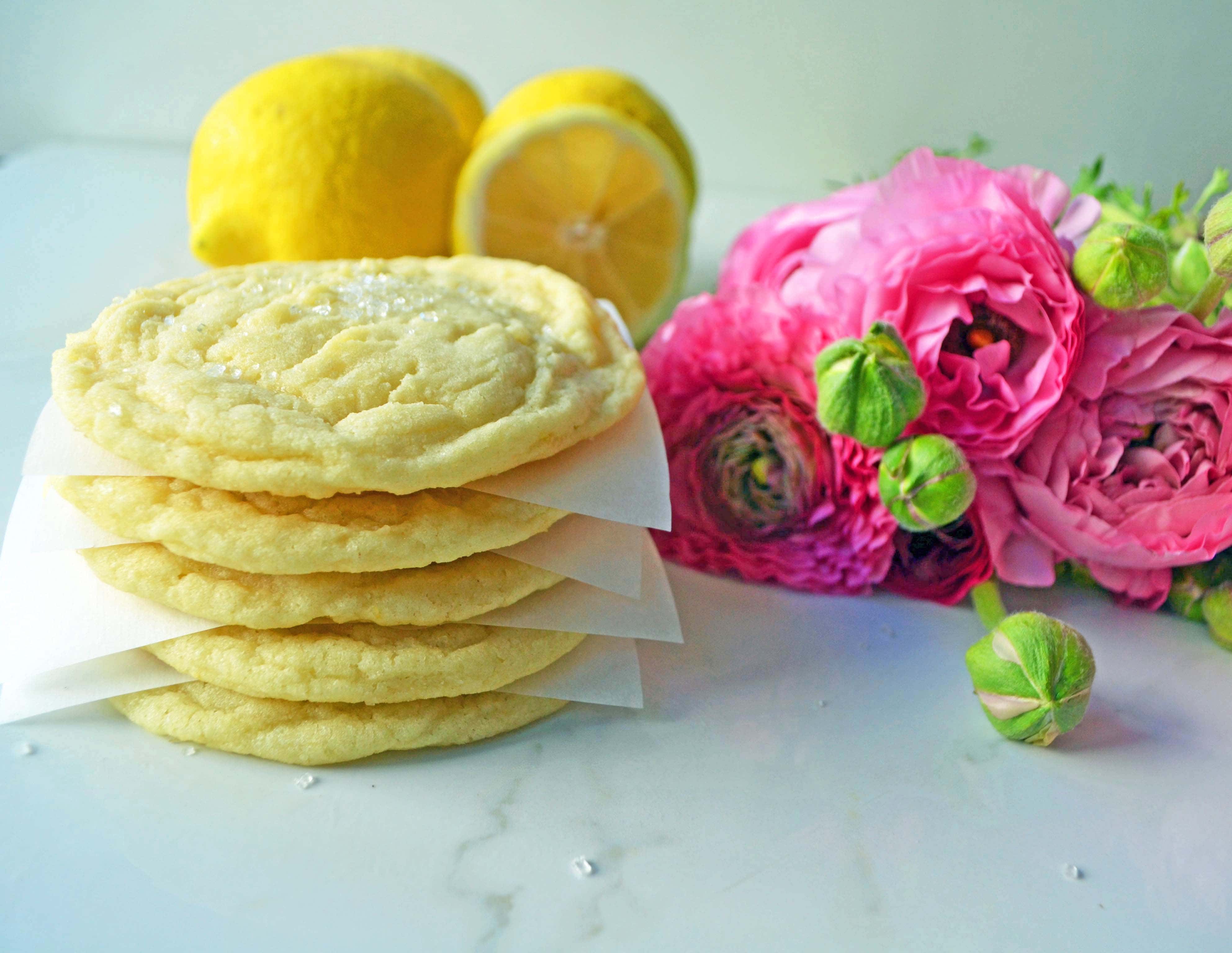 Soft chewy lemon sugar cookies. The perfect sugar cookie with lemon juice and zest to give it that perfect lemon flavor. A popular lemon cookie recipe! www.modernhoney.com #lemoncookies #lemon #lemondessert