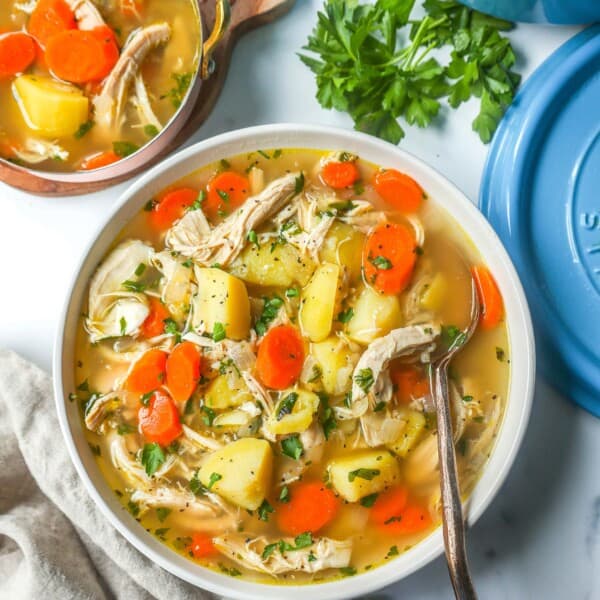 This Homemade Chicken Soup is made with tender chicken, carrots, onion, potatoes, fresh herbs, and seasonings all in a warm chicken broth. This is the perfect chicken soup on a cold winter's day. 