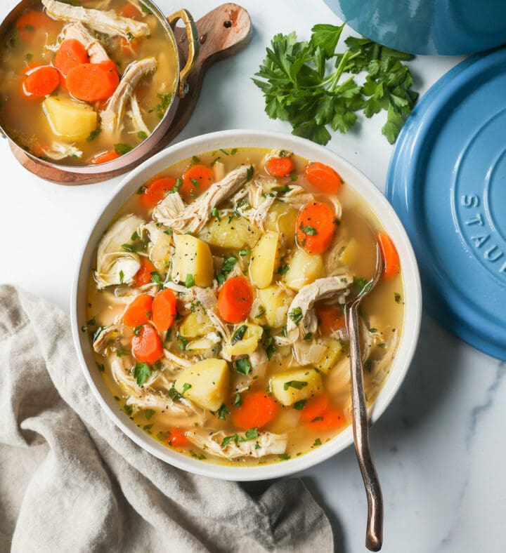 This Homemade Chicken Soup is made with tender chicken, carrots, onion, potatoes, fresh herbs, and seasonings all in a warm chicken broth. This is the perfect chicken soup on a cold winter's day. 