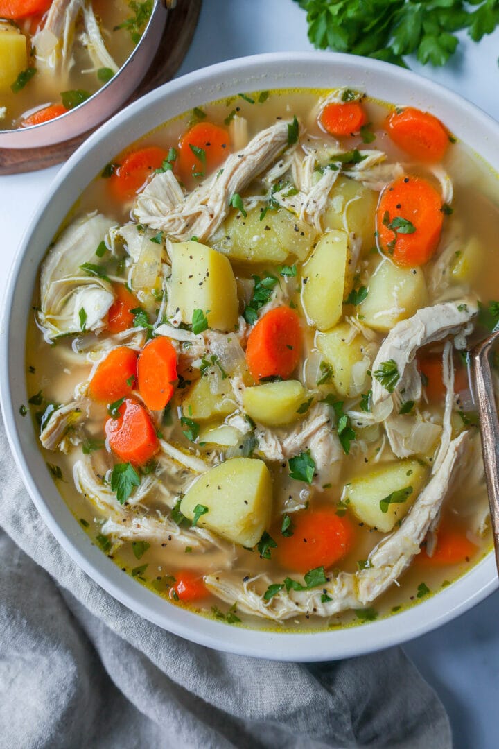 This Homemade Chicken Soup is made with tender chicken, carrots, onion, potatoes, fresh herbs, and seasonings all in a warm chicken broth. This is the perfect chicken soup on a cold winter's day. 