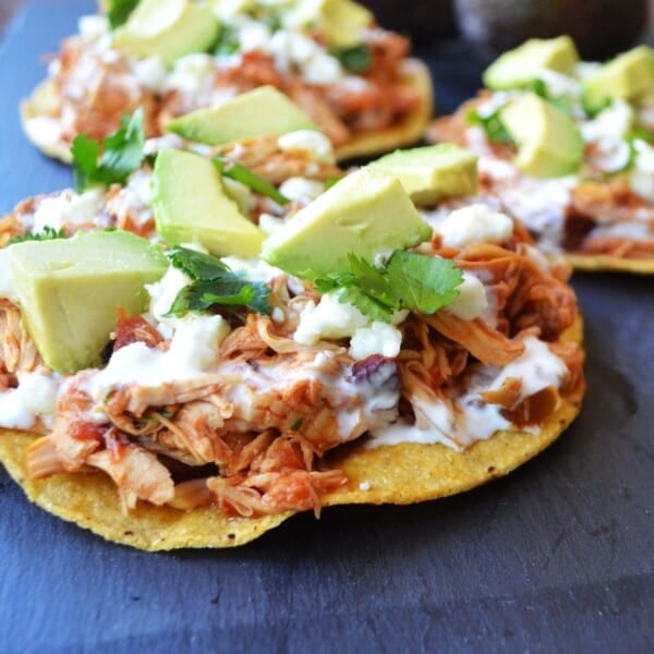 Slow Cooker Chicken Tinga Tostadas. 3 Ingredient Salsa chicken is the easiest dinner recipe and it tastes so good by Modern Honey - www.modernhoney.com