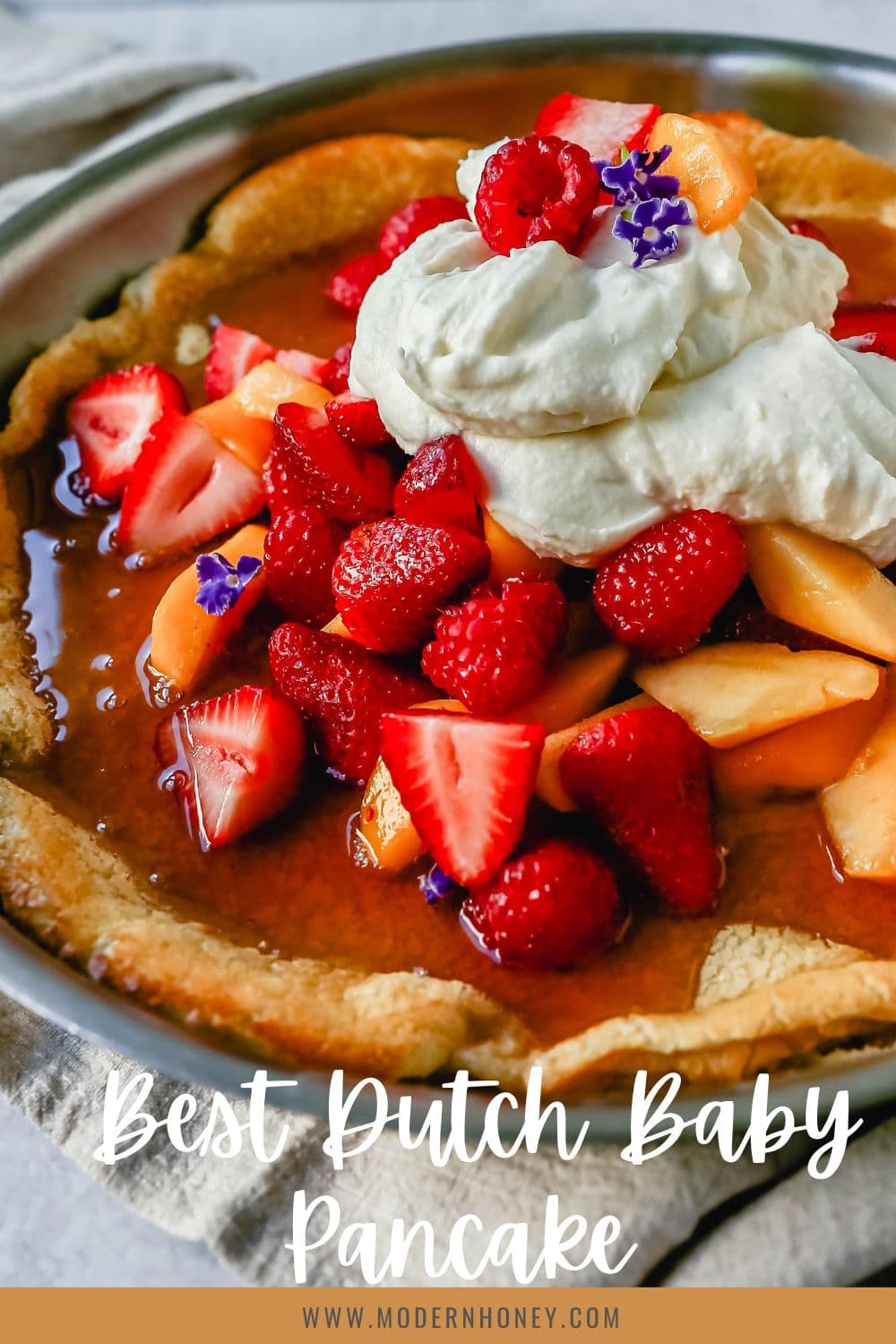 A decadent Dutch Baby Puff Pancake is made with milk, eggs, sugar, flour, and vanilla, and baked in a cast iron skillet in the oven until it puffs up and becomes a golden brown. A delicious and easy breakfast dish!