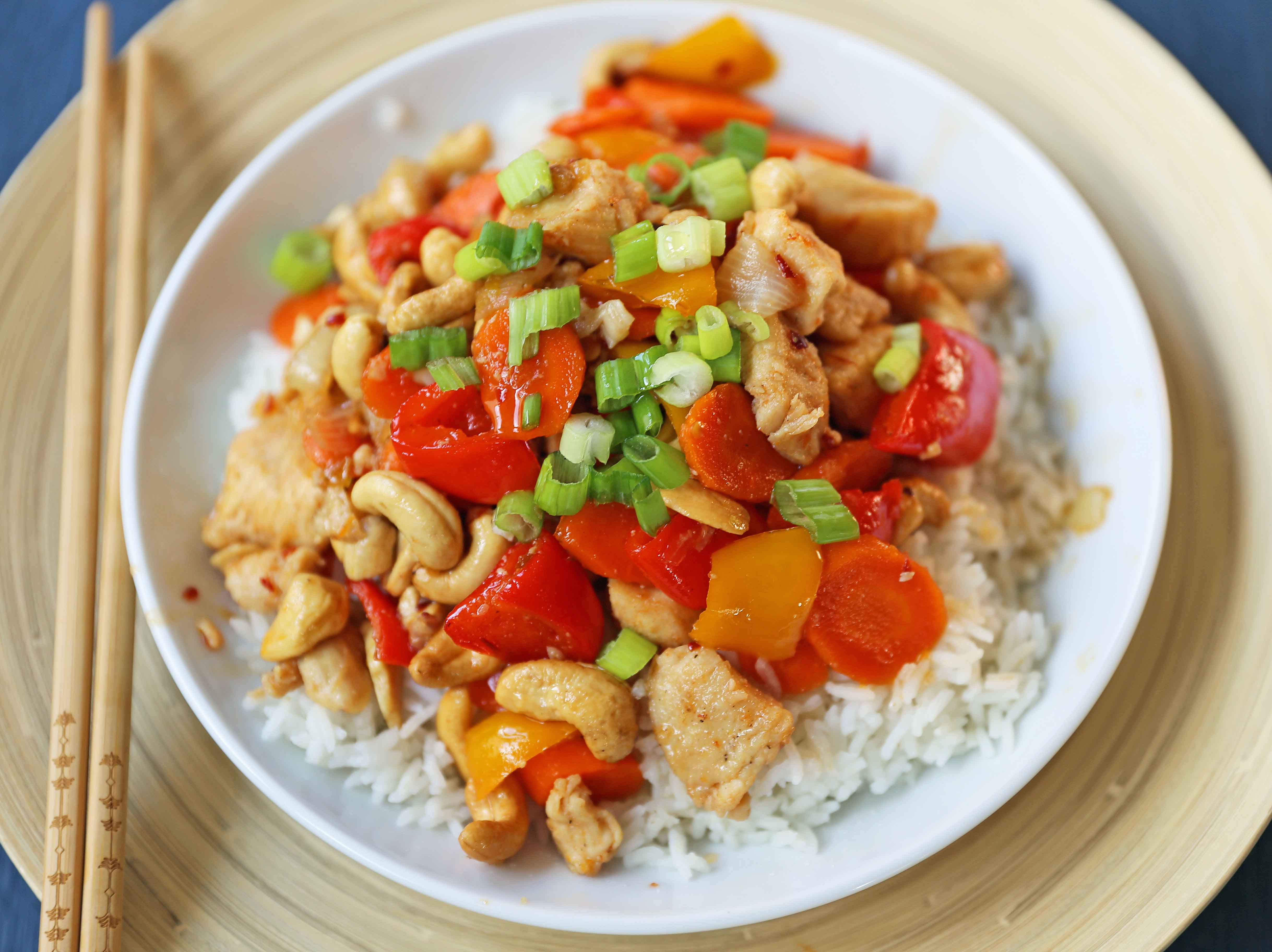 Honey Cashew Chicken. A healthier version of a popular Asian dish -- Cashew Chicken.  Gluten-Free. Dairy-Free. Sugar-Free.  A spicy and sweet chicken with crisp vegetables in a flavorful sauce.  www.modernhoney.com #honeycashewchicken #cashewchicken #chinesechicken #asianfood 