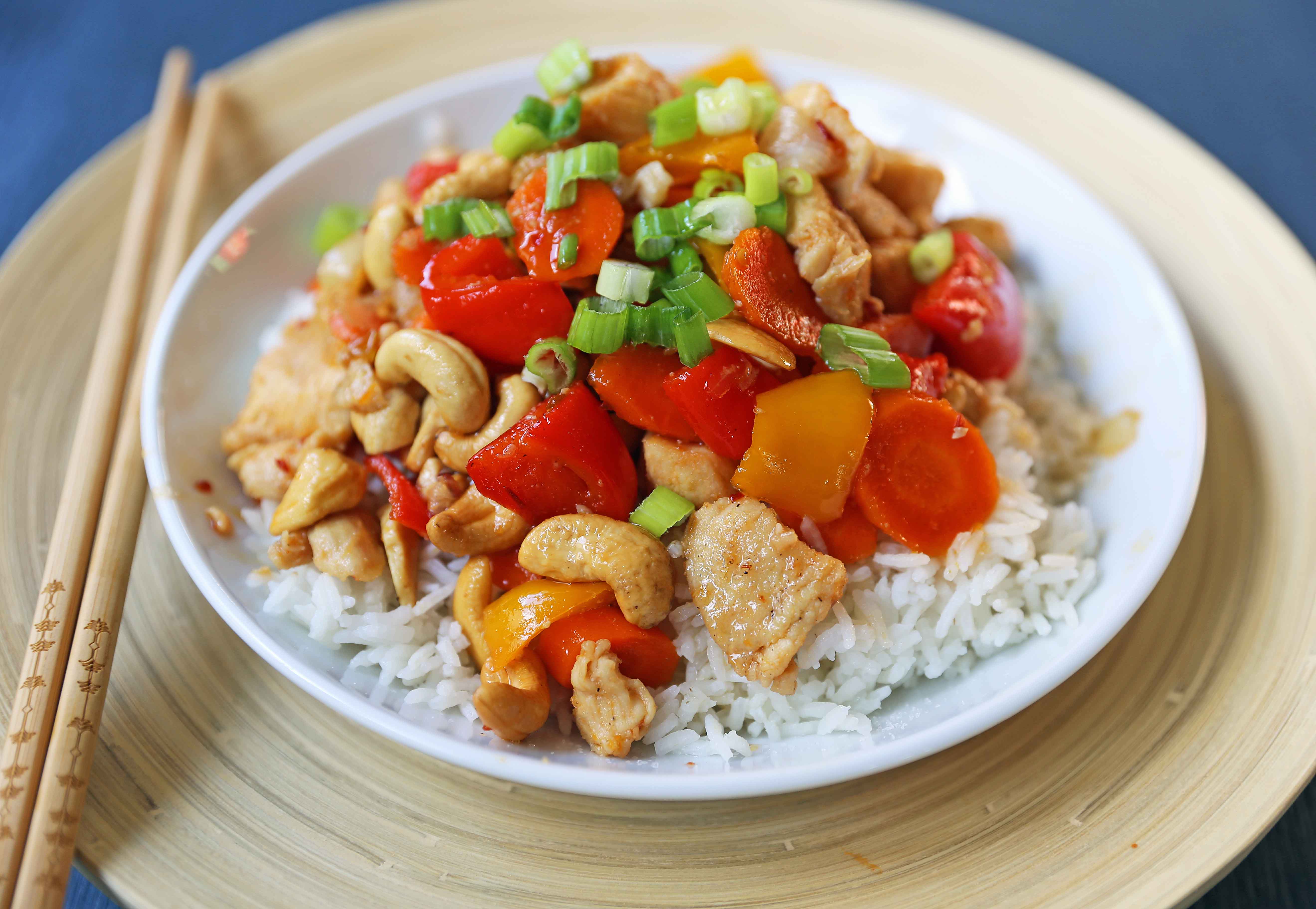 Honey Cashew Chicken. A healthier version of a popular Asian dish -- Cashew Chicken.  Gluten-Free. Dairy-Free. Sugar-Free.  A spicy and sweet chicken with crisp vegetables in a flavorful sauce.  www.modernhoney.com #honeycashewchicken #cashewchicken #chinesechicken #asianfood 