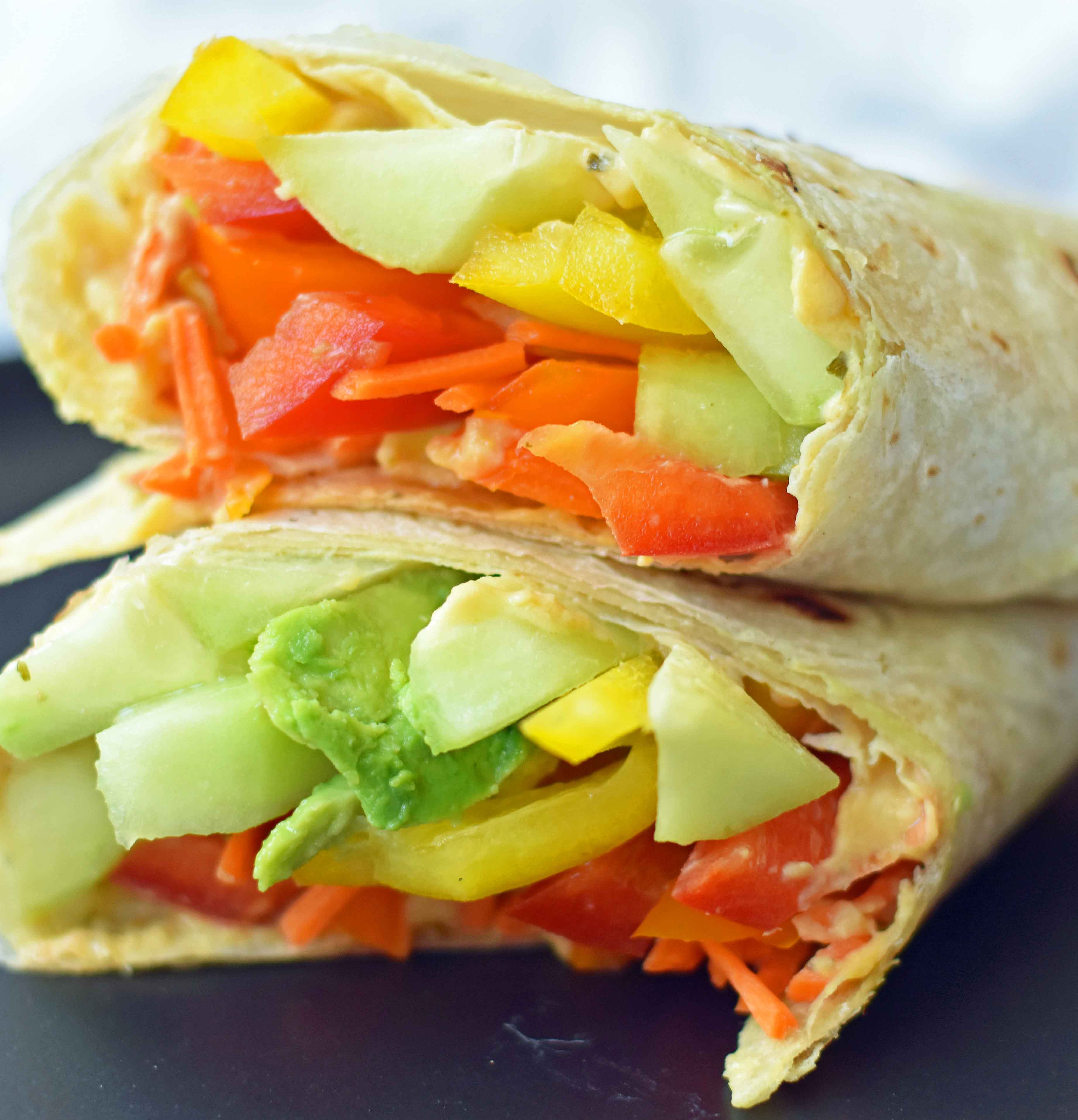 Hummus Veggie Wraps. Homemade avocado ranch hummus with veggies rolled into flour tortillas. Healthy veggie wraps. www.modernhoney.com #healthy #wraps #healthywraps #veggiewraps