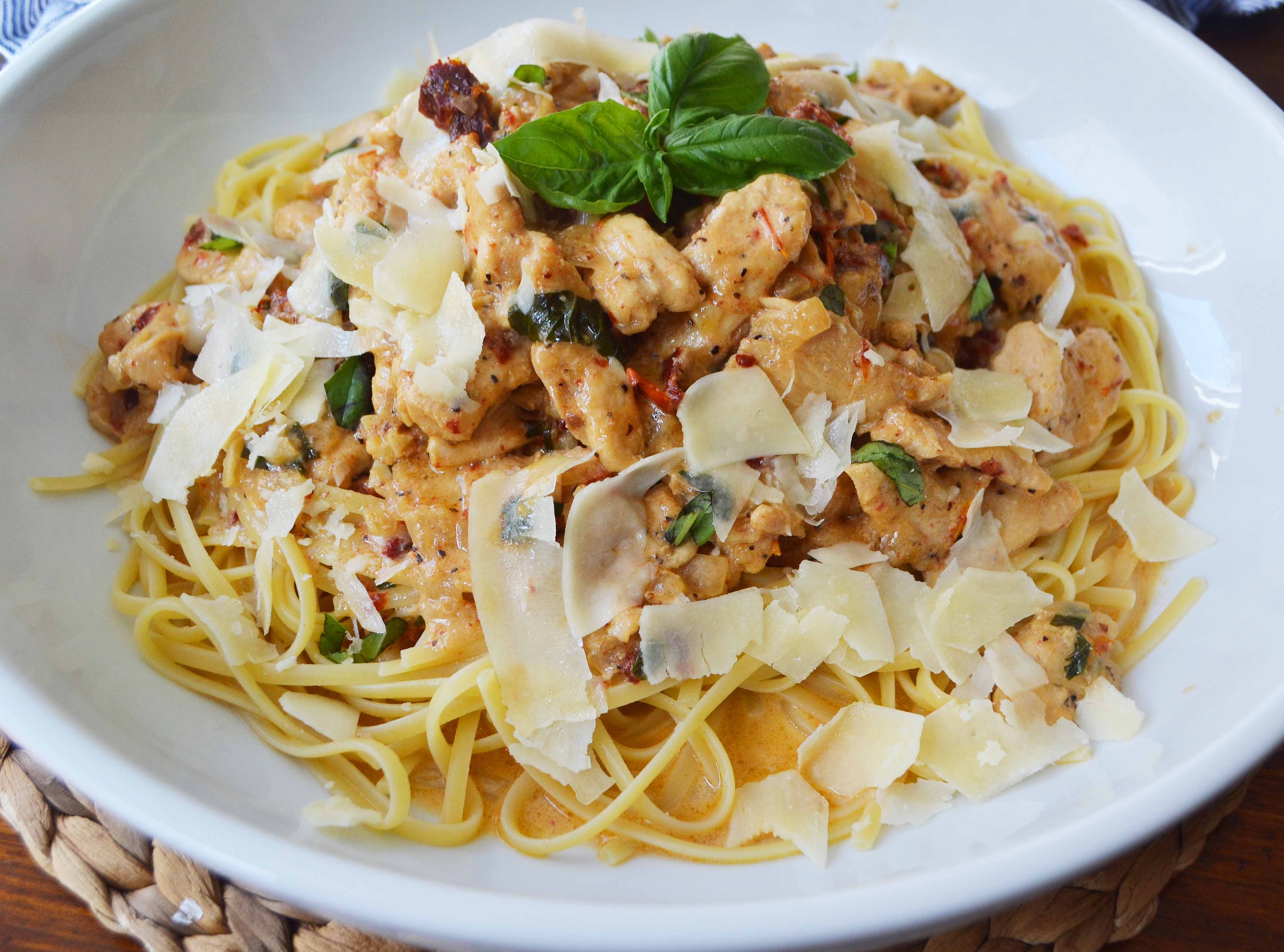 The Love Machine Chicken Pasta. Chicken sauteed in butter and garlic and rich sundried tomato cream sauce. Topped with freshly grated parmesan cheese and basil.