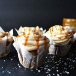 Pumpkin Cupcakes with Salted Caramel Frosting by Modern Honey. Homemade, made from scratch salted carmel frosting tops a cinnamon spiced pumpkin cupcake. The perfect Fall dessert! www.modernhoney.com