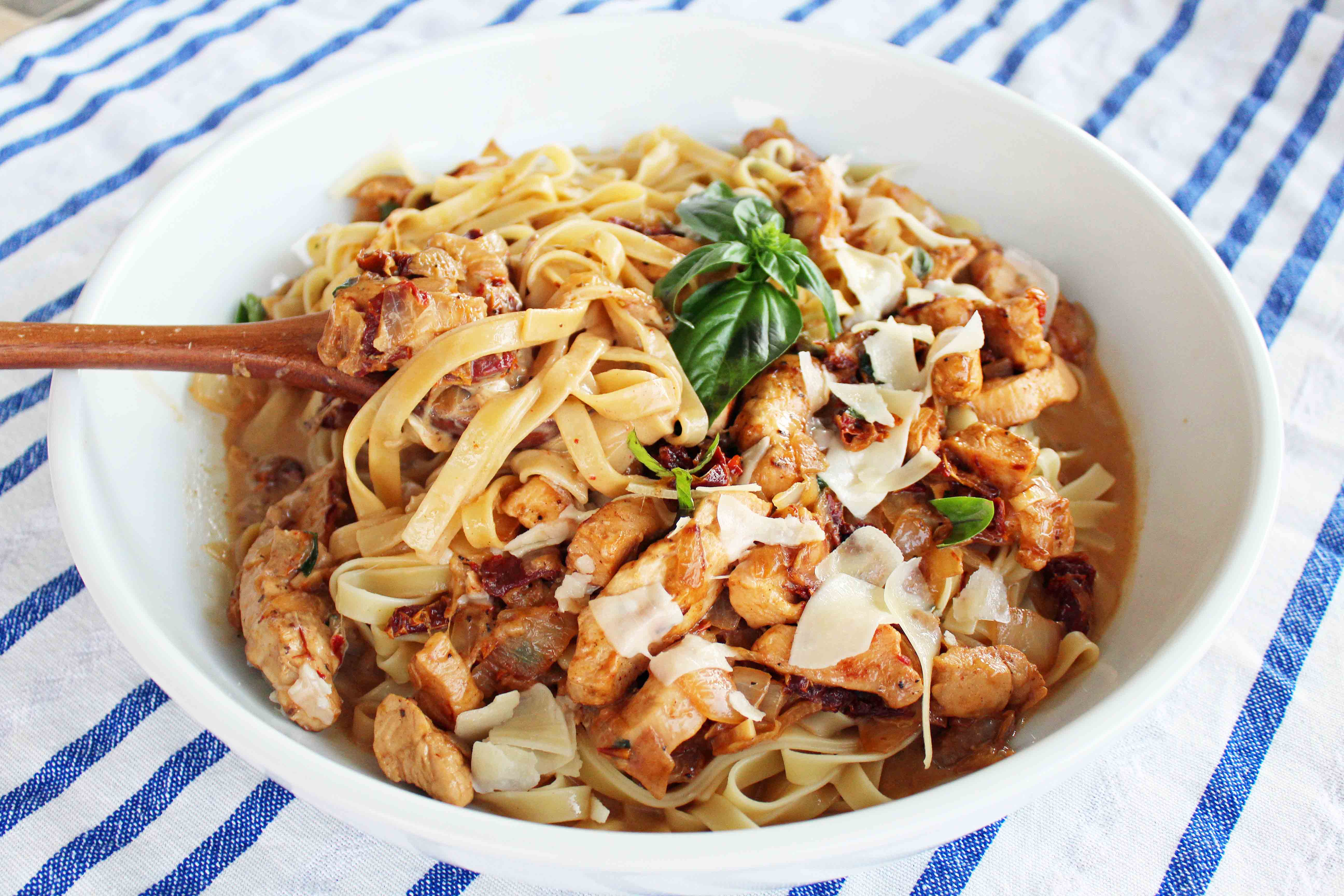 The Love Machine Chicken Pasta. Chicken sauteed in butter and garlic and rich sundried tomato cream sauce. Topped with freshly grated parmesan cheese and basil.