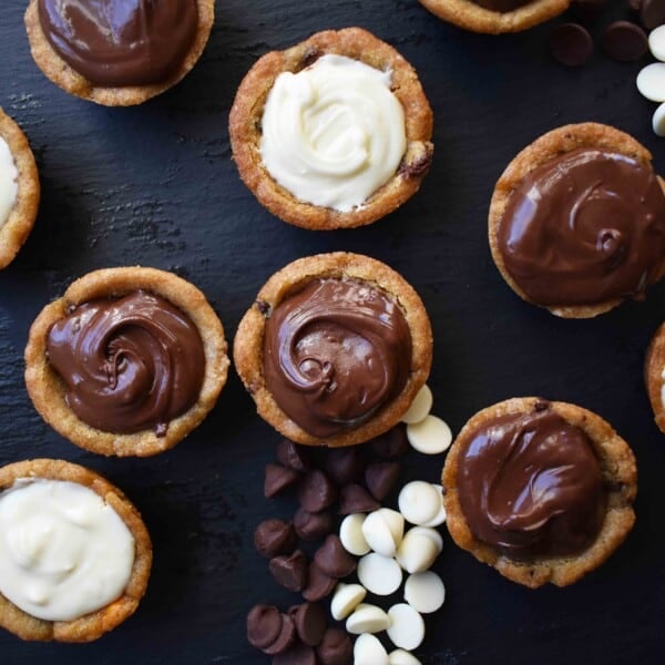 Chocolate Ganache Filled Cookie Cups. Rich chocolate ganache in the center of a chocolate chip cookie cup. A heavenly chocolate dessert!