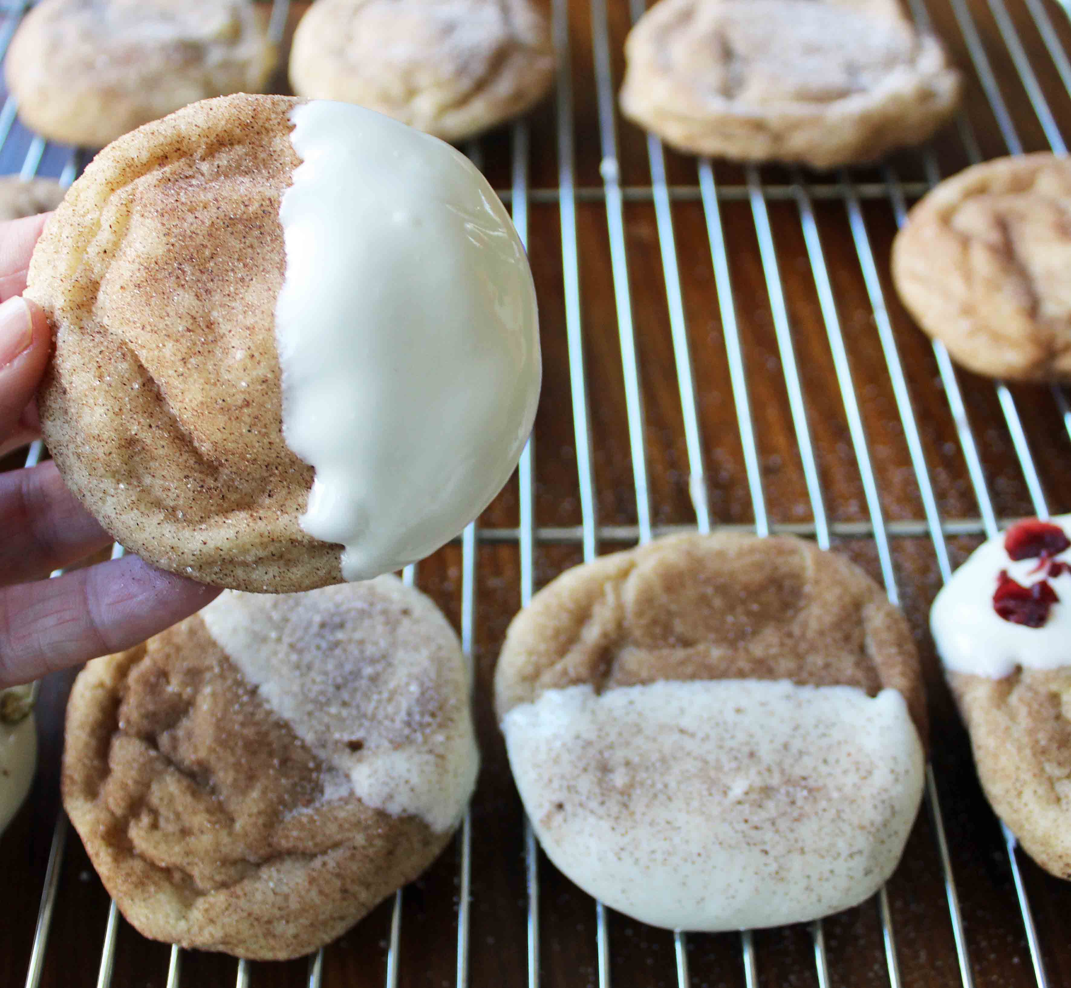 White Chocolate Dipper Snickerdoodles. The only Snickerdoodle Cookie recipe you will ever need. Perfect cinnamon sugar Snickerdoodles every single time. Snickerdoodles dipped in white chocolate make them even better. www.modernhoney.com