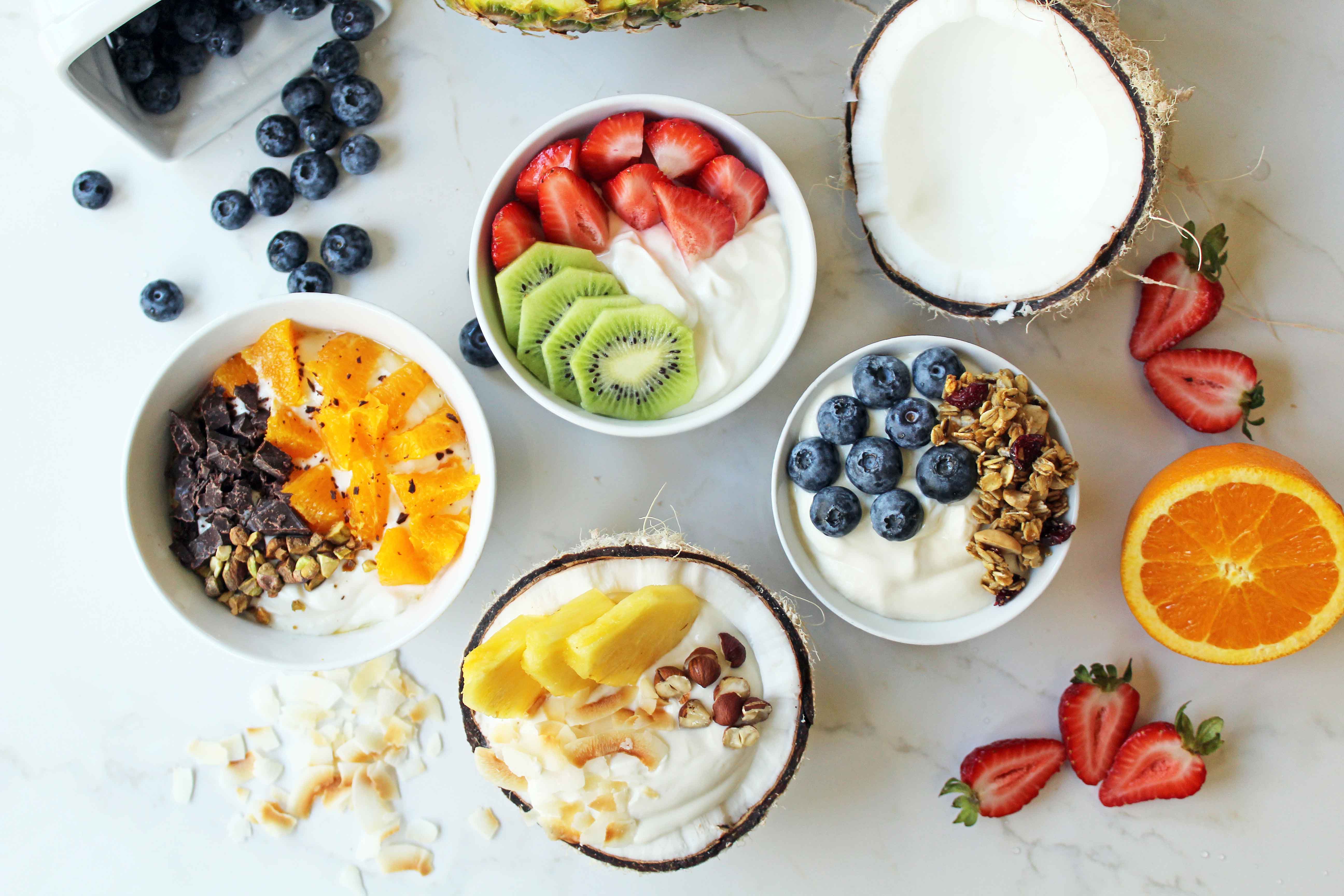 Greek Yogurt Breakfast Bowls with Toppings by Modern Honey. Healthy Greek Yogurt topped with fresh fruits, nuts, and honey. It's a perfect breakfast to start the day!