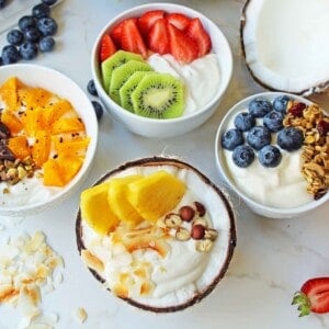 Greek Yogurt Breakfast Bowls with Toppings by Modern Honey. Healthy Greek Yogurt topped with fresh fruits, nuts, and honey. It's a perfect breakfast to start the day!