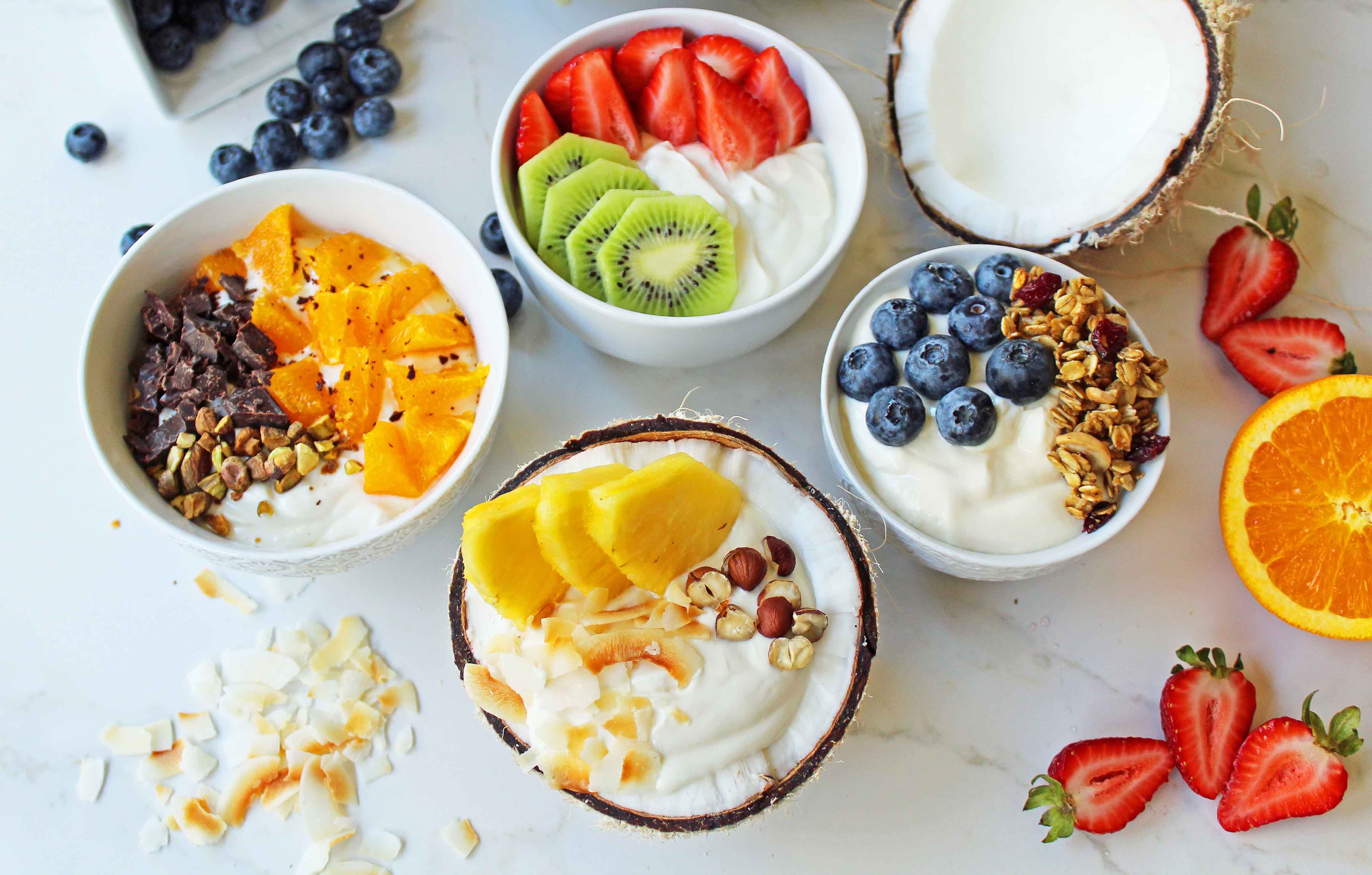 Greek Yogurt Breakfast Bowls with Toppings by Modern Honey. Healthy Greek Yogurt topped with fresh fruits, nuts, and honey. It's a perfect breakfast to start the day!