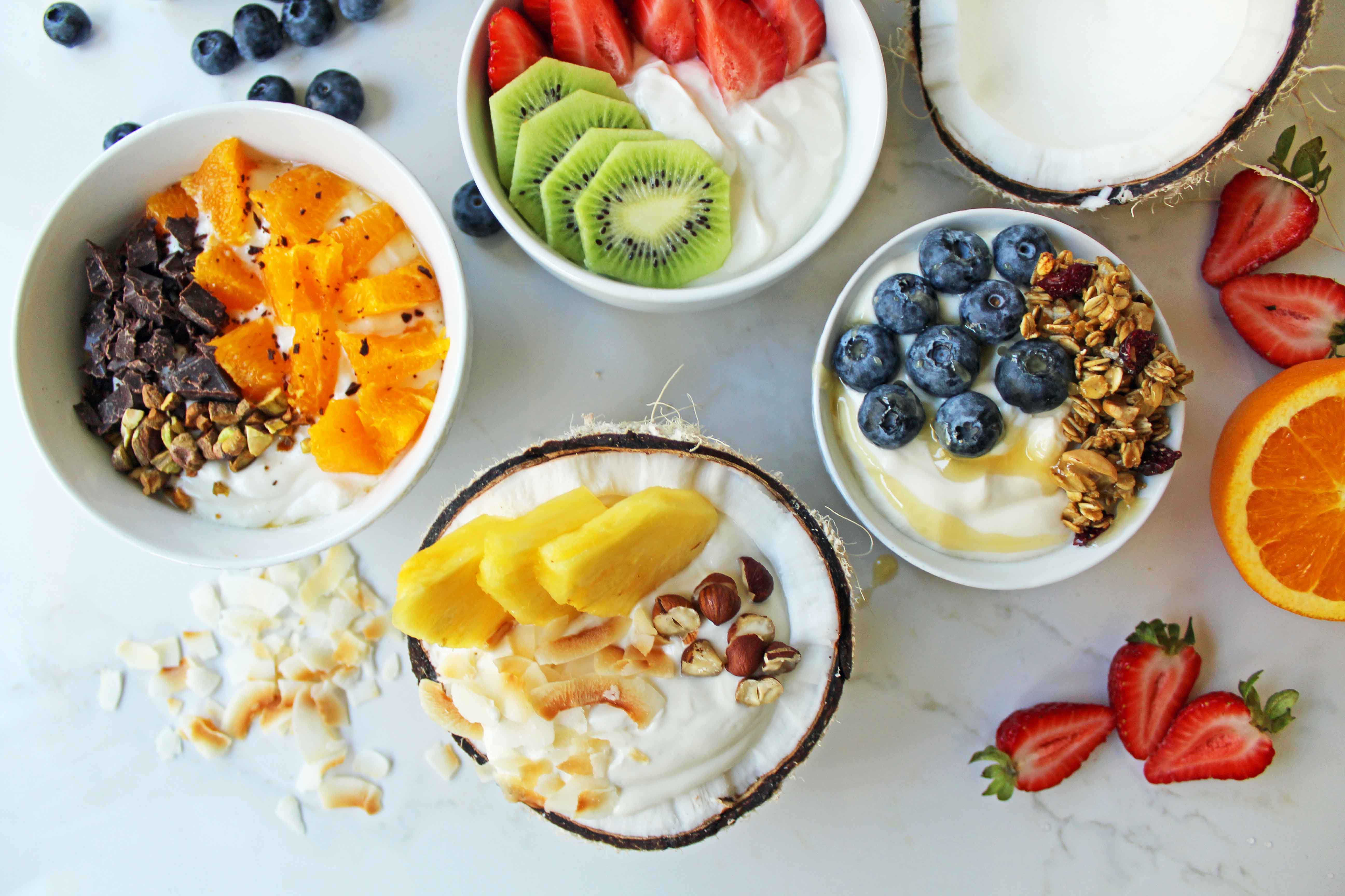 Greek Yogurt Breakfast Bowls with Toppings by Modern Honey. Healthy Greek Yogurt topped with fresh fruits, nuts, and honey. It's a perfect breakfast to start the day!