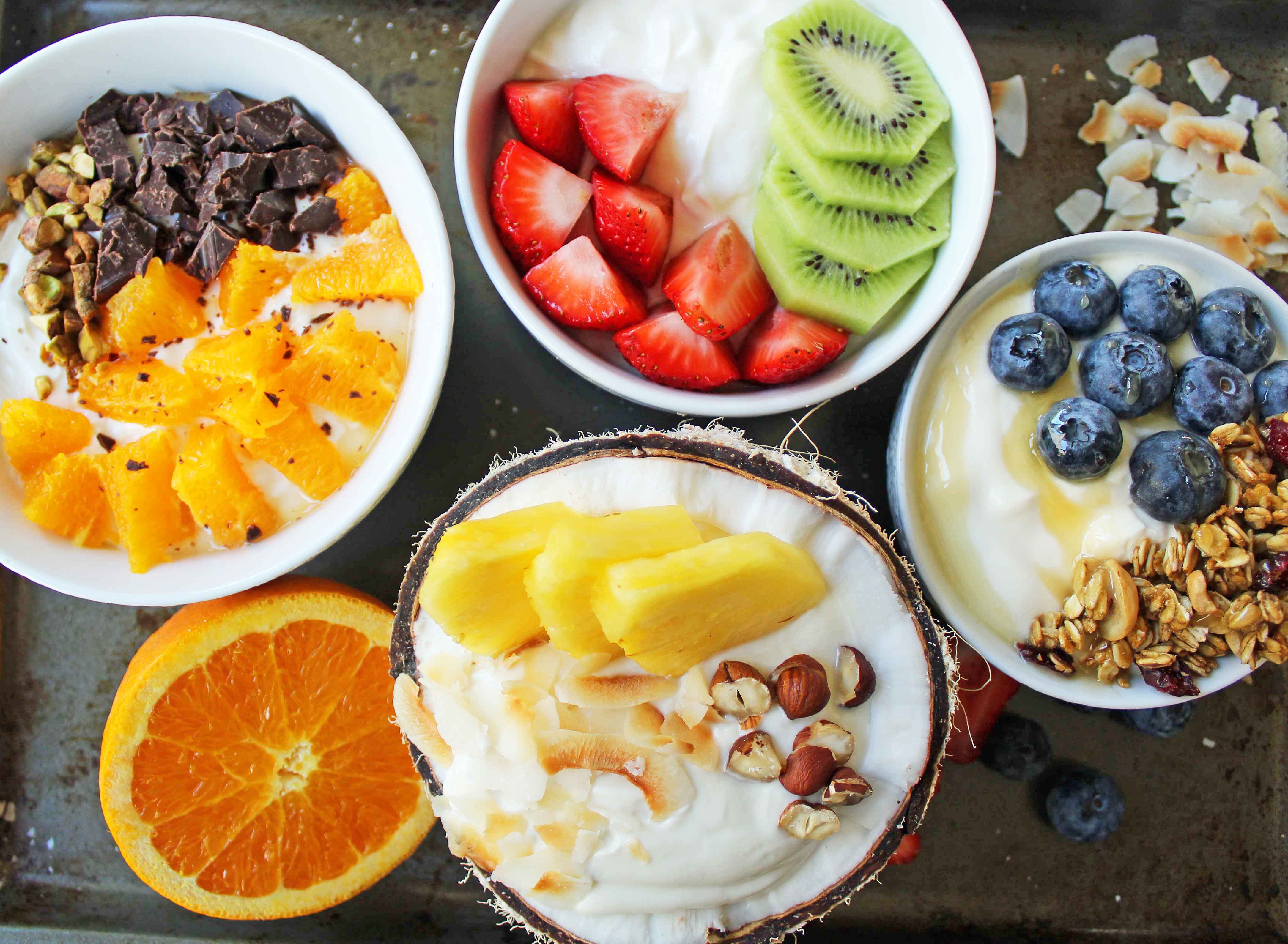 Greek Yogurt Breakfast Bowls with Toppings by Modern Honey. Healthy Greek Yogurt topped with fresh fruits, nuts, and honey. It's a perfect breakfast to start the day!