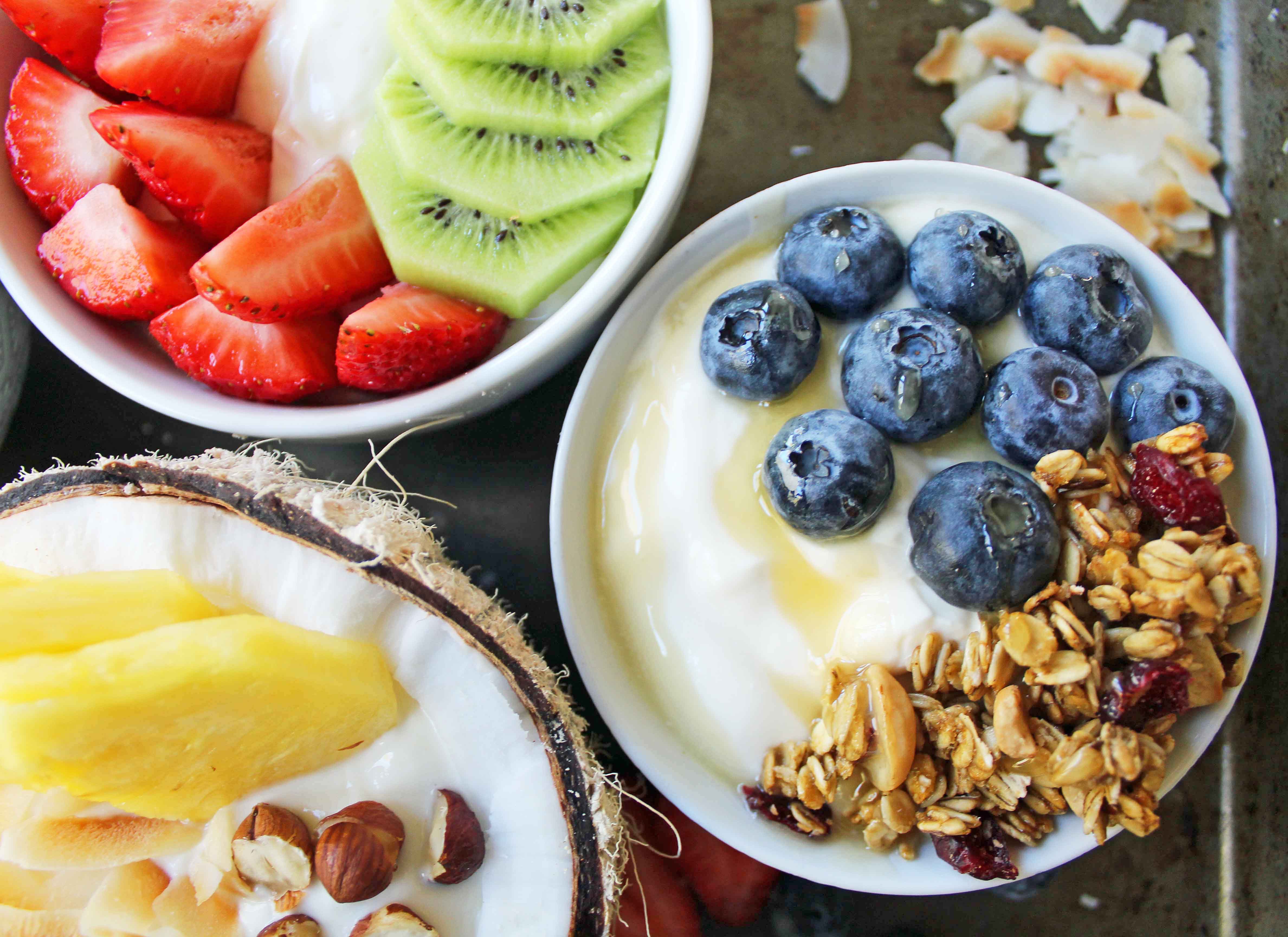 Greek Yogurt Breakfast Bowls with Toppings by Modern Honey. Healthy Greek Yogurt topped with fresh fruits, nuts, and honey. It's a perfect breakfast to start the day!