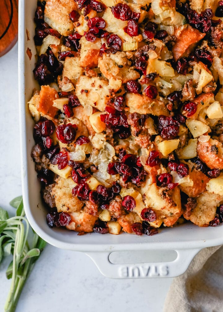 Classic Sausage Herb Stuffing with Fresh Apples and Cranberries make this the most savory Thanksgiving stuffing recipe. This Homemade Sausage Stuffing is the perfect Thanksgiving side dish recipe.