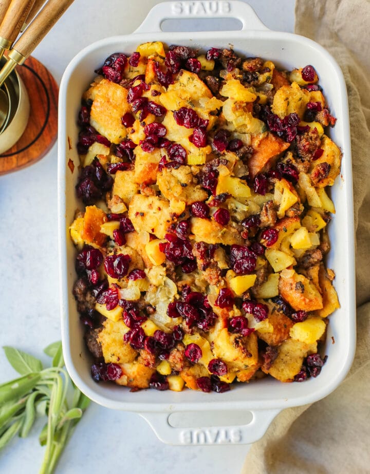 Classic Sausage Herb Stuffing with Fresh Apples and Cranberries make this the most savory Thanksgiving stuffing recipe. This Homemade Sausage Stuffing is the perfect Thanksgiving side dish recipe.