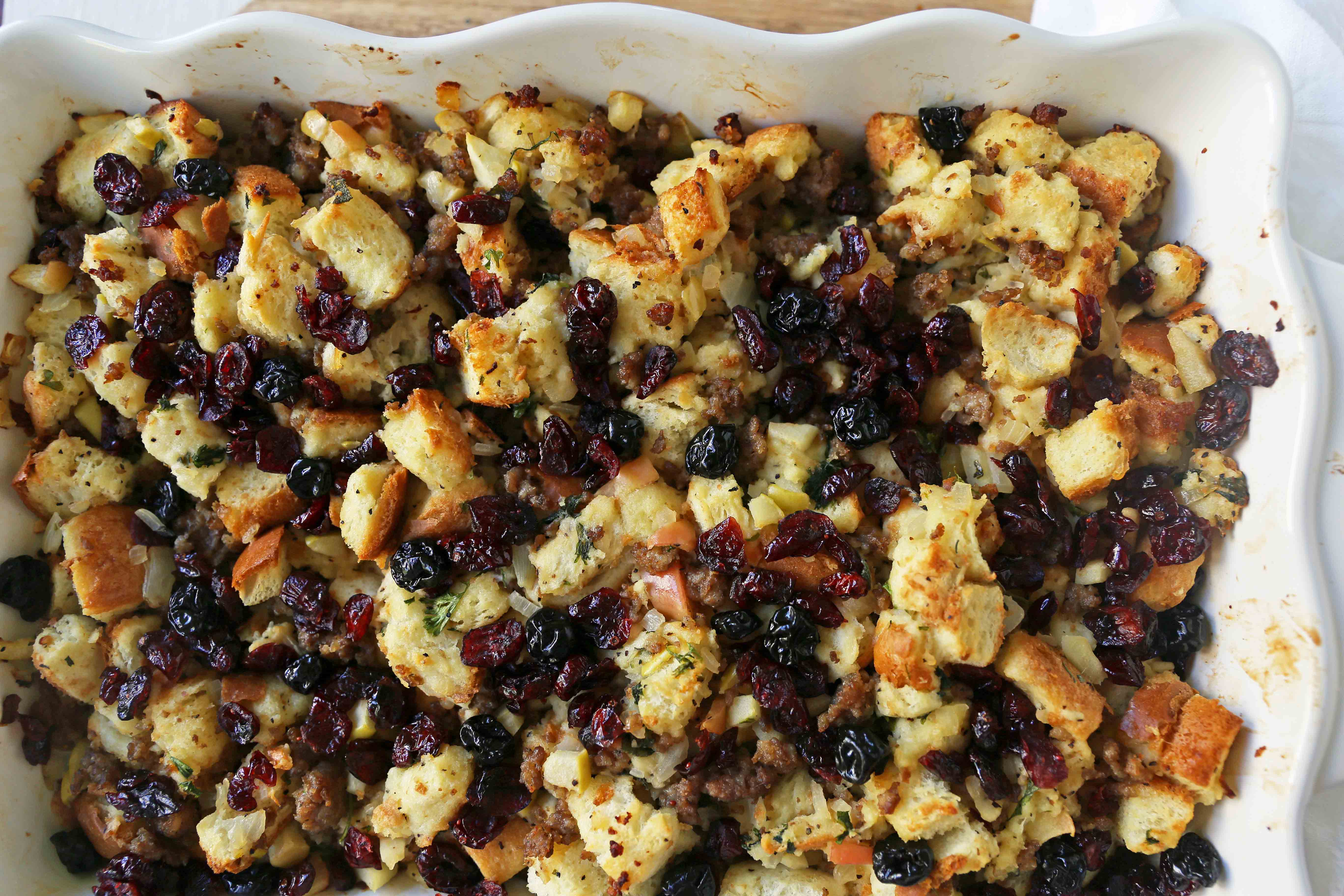 Cranberry Apple Sausage Stuffing. A classic Thanksgiving side dish that is a real crowd pleaser! Homemade Sausage Cranberry Apple Stuffing Recipe. www.modernhoney.com #stuffing #sausasgestuffing #cranberryapplestuffing #sausageapplestuffing #thanksgiving #thanksgivingsides