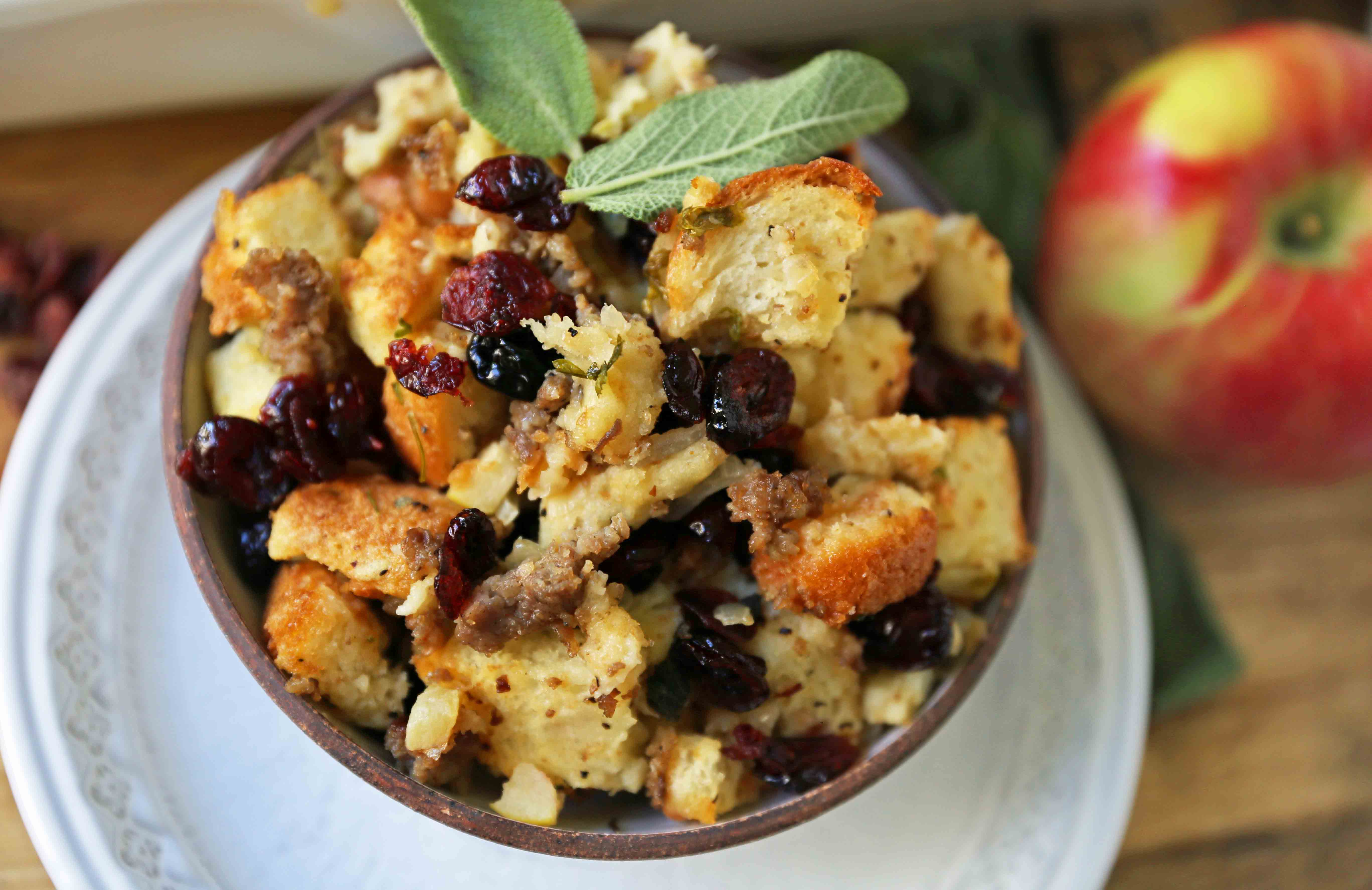 Cranberry Apple Sausage Stuffing. A classic Thanksgiving side dish that is a real crowd pleaser! Homemade Sausage Cranberry Apple Stuffing Recipe. www.modernhoney.com #stuffing #sausasgestuffing #cranberryapplestuffing #sausageapplestuffing #thanksgiving #thanksgivingsides