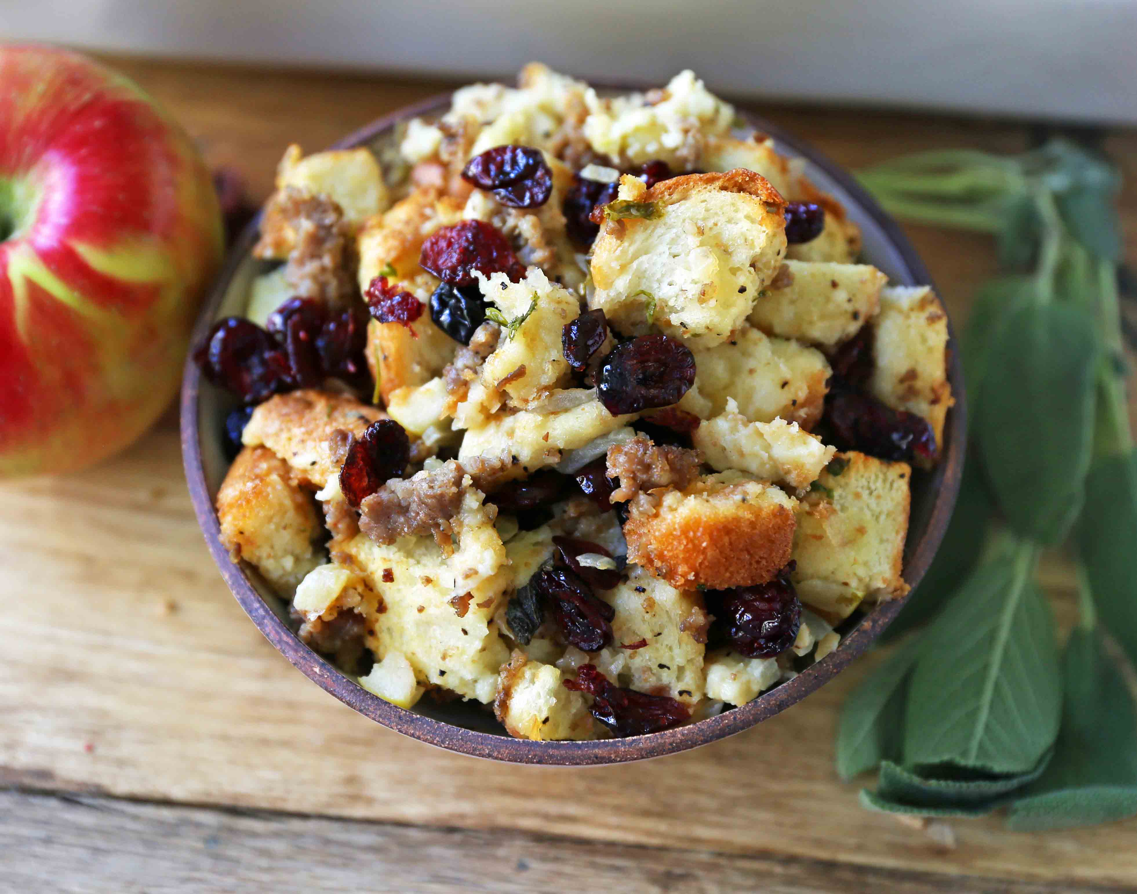 Cranberry Apple Sausage Stuffing. A classic Thanksgiving side dish that is a real crowd pleaser! Homemade Sausage Cranberry Apple Stuffing Recipe. www.modernhoney.com #stuffing #sausasgestuffing #cranberryapplestuffing #sausageapplestuffing #thanksgiving #thanksgivingsides