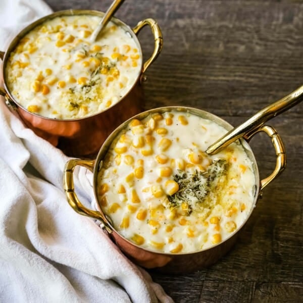 How to make the best creamed corn. A creamy corn recipe made with heavy cream, butter, corn, parmesan cheese, a touch of sugar and salt. A popular side dish or Thanksgiving side dish recipe. www.modernhoney.com #corn #creamedcorn #gullliverscorn #sidedish #thanksgiving