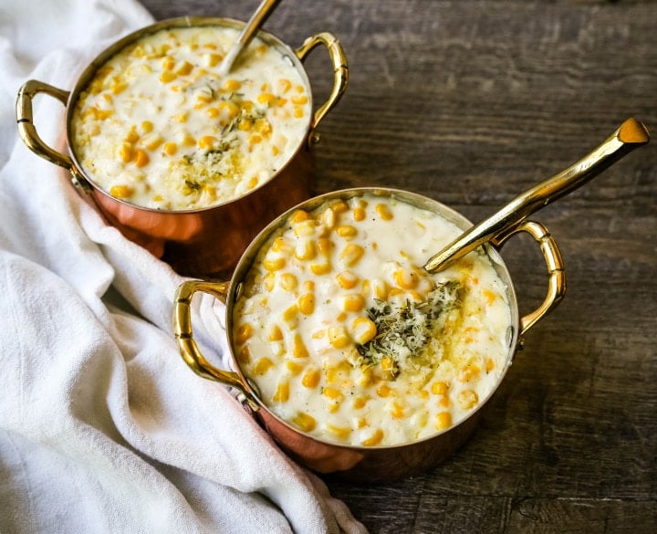 How to make the best creamed corn. A creamy corn recipe made with heavy cream, butter, corn, parmesan cheese, a touch of sugar and salt. A popular side dish or Thanksgiving side dish recipe. www.modernhoney.com #corn #creamedcorn #gullliverscorn #sidedish #thanksgiving