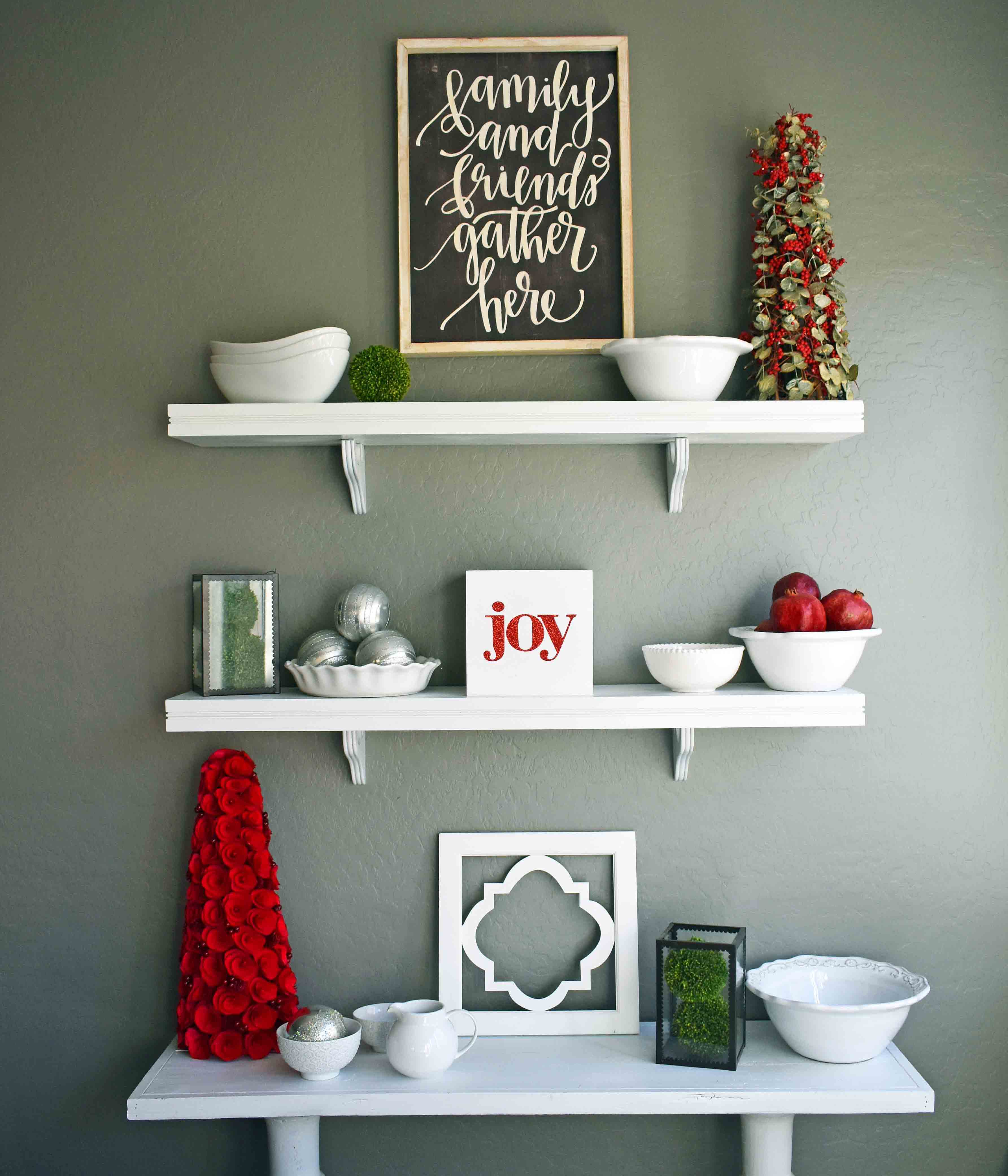 Christmas Decor Ideas by Modern Honey. Beautiful ways to transform your home for Christmas. White wall shelving with white dishes for kitchen.