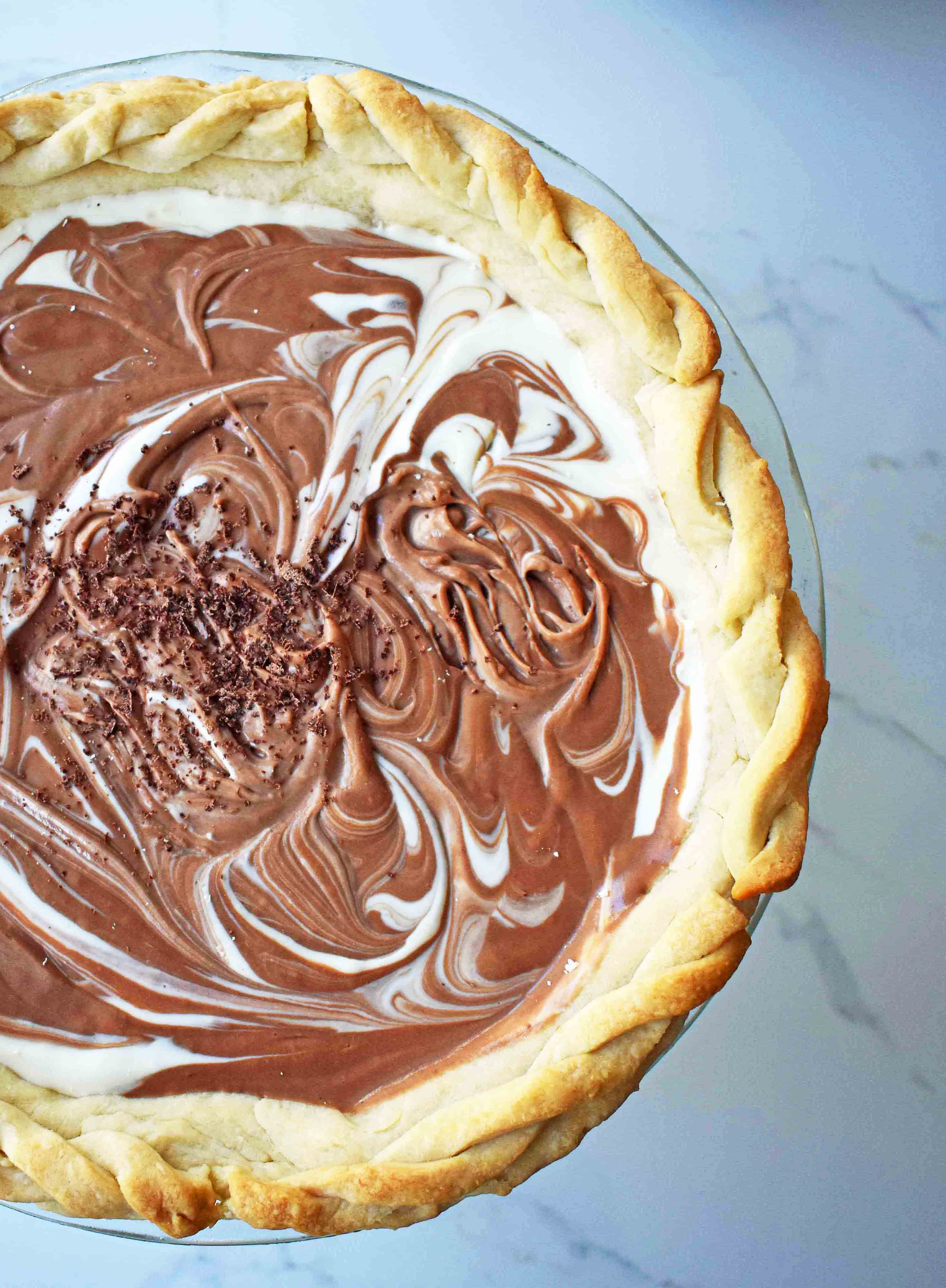 Chocolate Marshmallow Marble Pie. Chocolate Marshmallow Cream swirled together with White Chocolate Marshmallow Cream for a rich, decadent, popular pie.