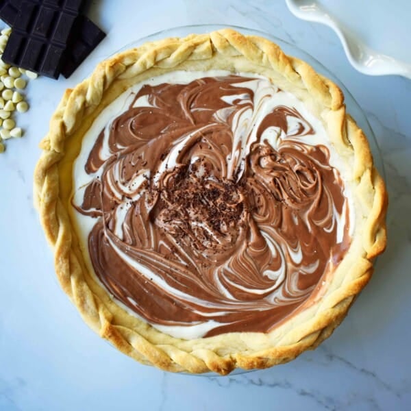 Chocolate Marshmallow Marble Pie. Chocolate Marshmallow Cream swirled together with White Chocolate Marshmallow Cream for a rich, decadent, popular pie.