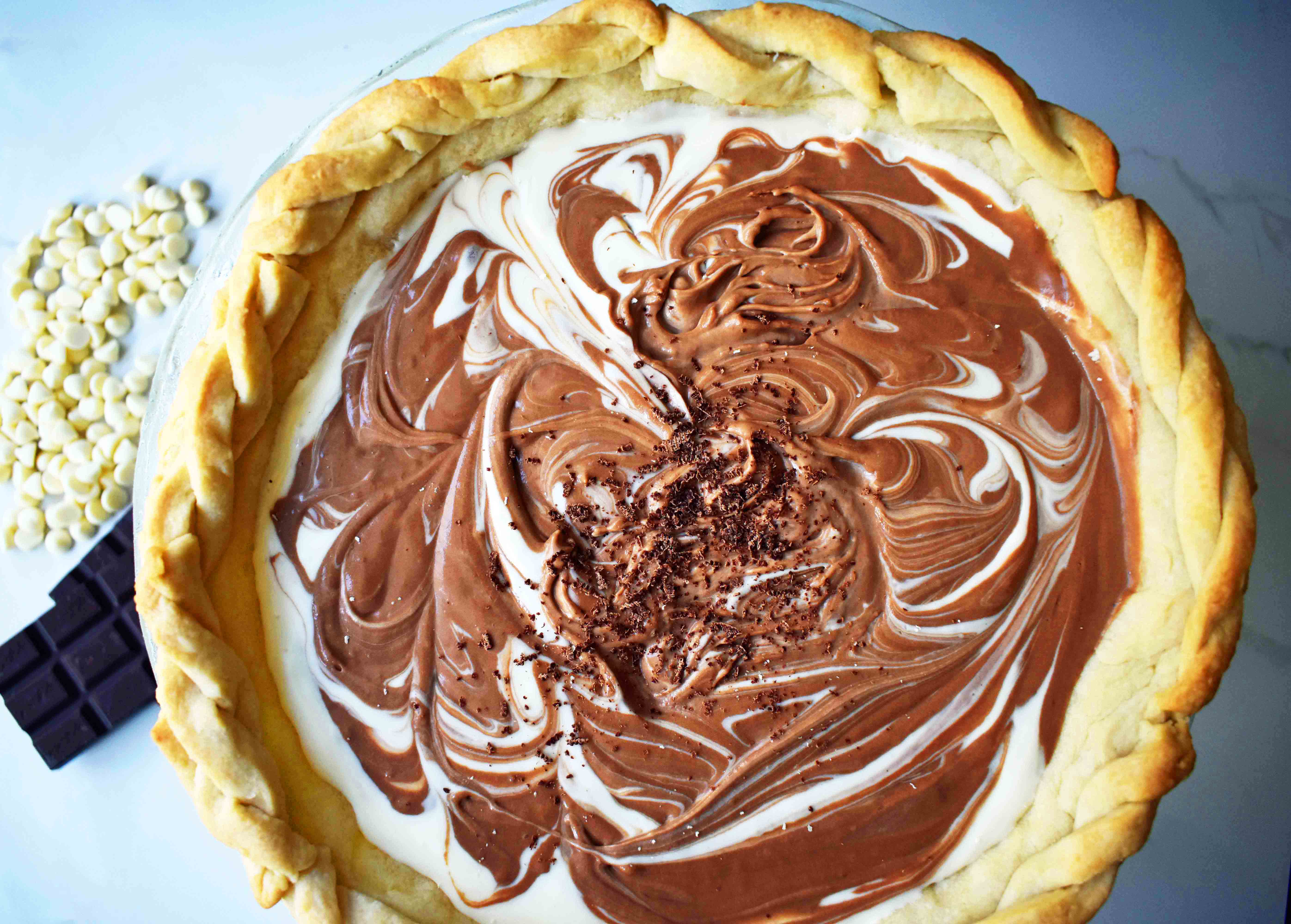 Chocolate Marshmallow Marble Pie. Chocolate Marshmallow Cream swirled together with White Chocolate Marshmallow Cream for a rich, decadent, popular pie.