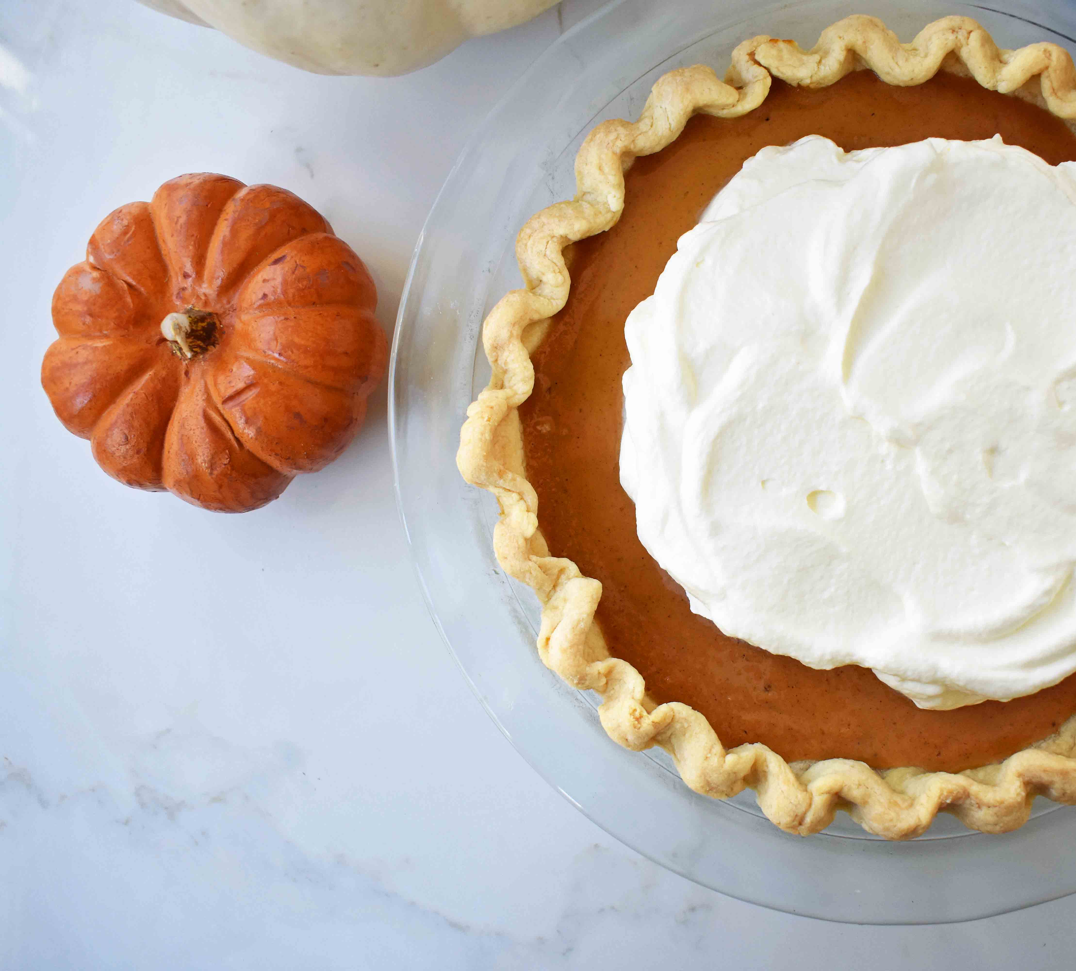 Perfect Pumpkin Pie by Modern Honey. Pumpkin Pie filling made with sweetened condensed milk, eggs, and spices. Creamy Pumpkin Pie every time!