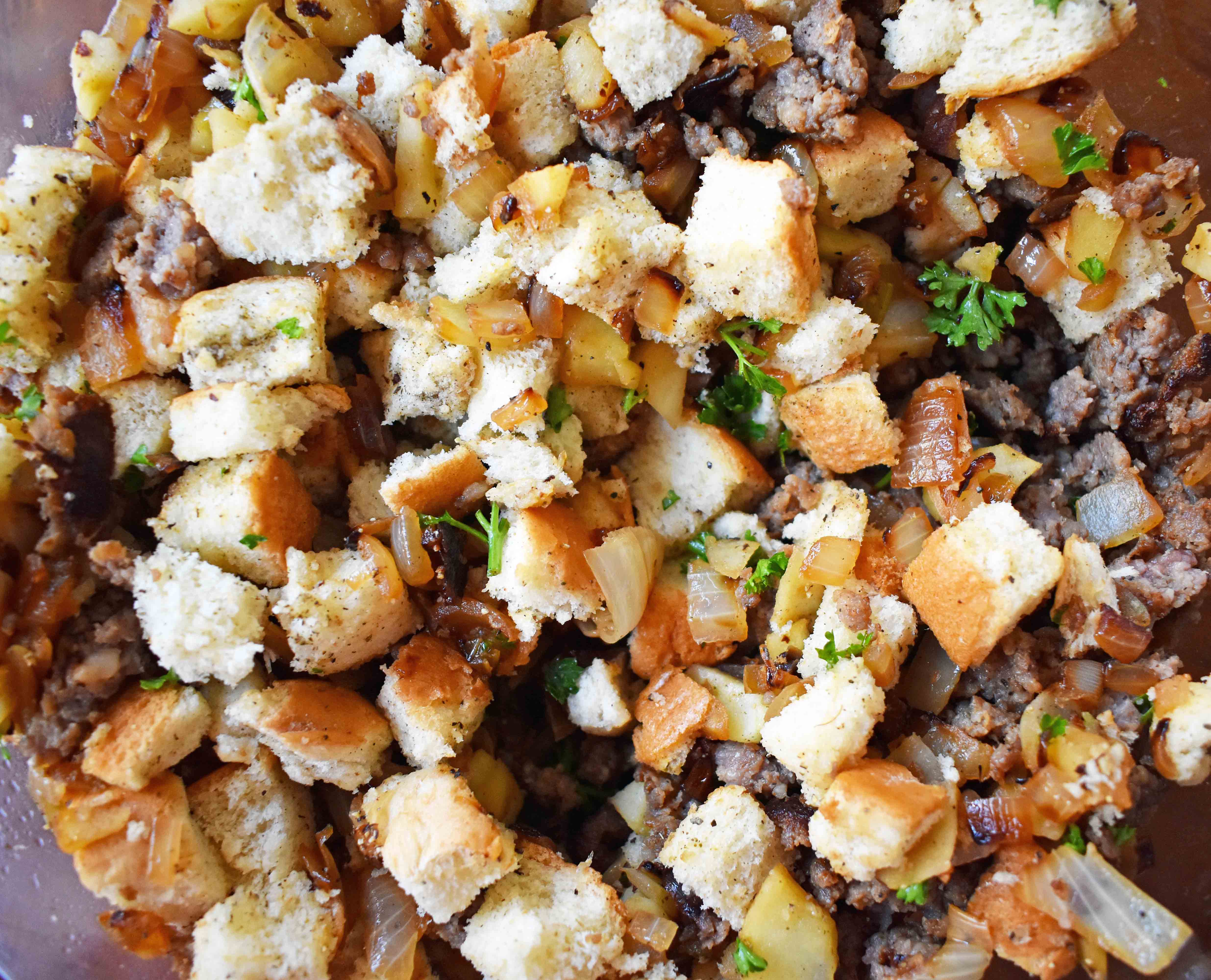 Cranberry Apple Sausage Stuffing by Modern Honey. Classic Bread Stuffing with Sausage, Dried Cranberries, and Crisp Apples. The perfect Thanksgiving side dish recipe!