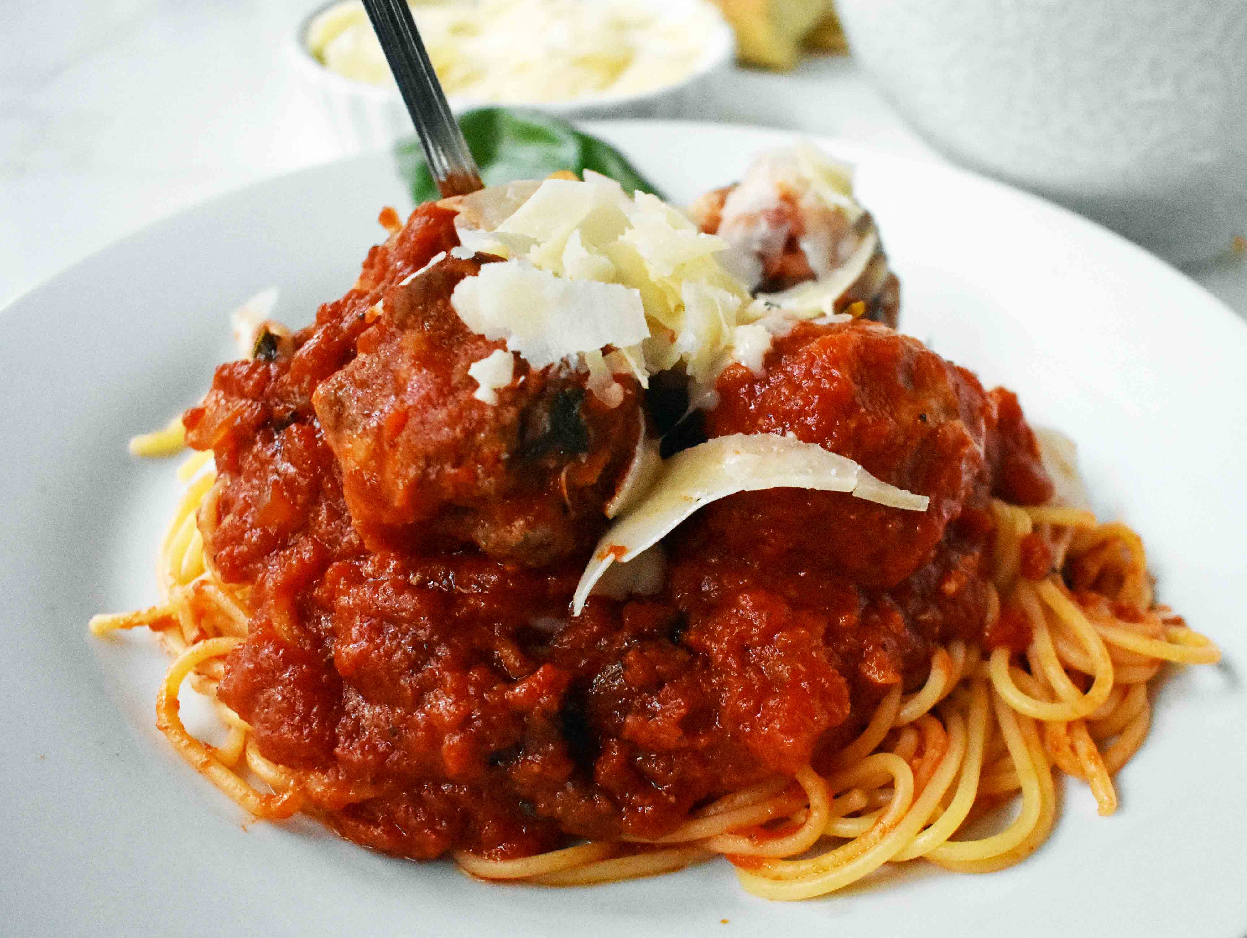 Mama's Best Ever Spaghetti and Meatballs by Modern Honey. Homemade meatballs made from scratch. Authentic Italian meatballs and marinara sauce.