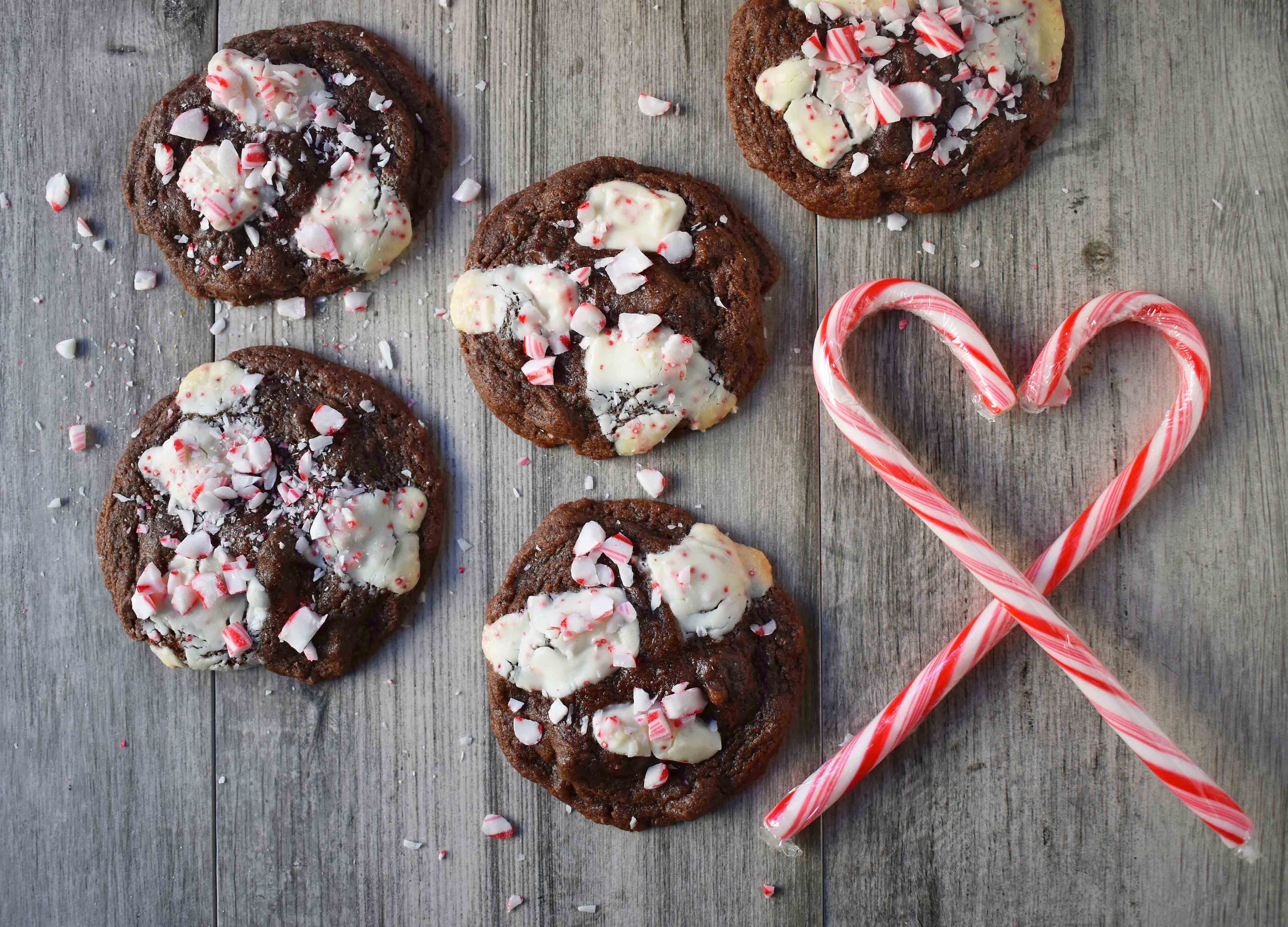 Mrs. Claus Chocolate Peppermint Cookies by Modern Honey. Rich chocolate chunks cookies with peppermint bark and candy canes. The most popular Christmas cookie!