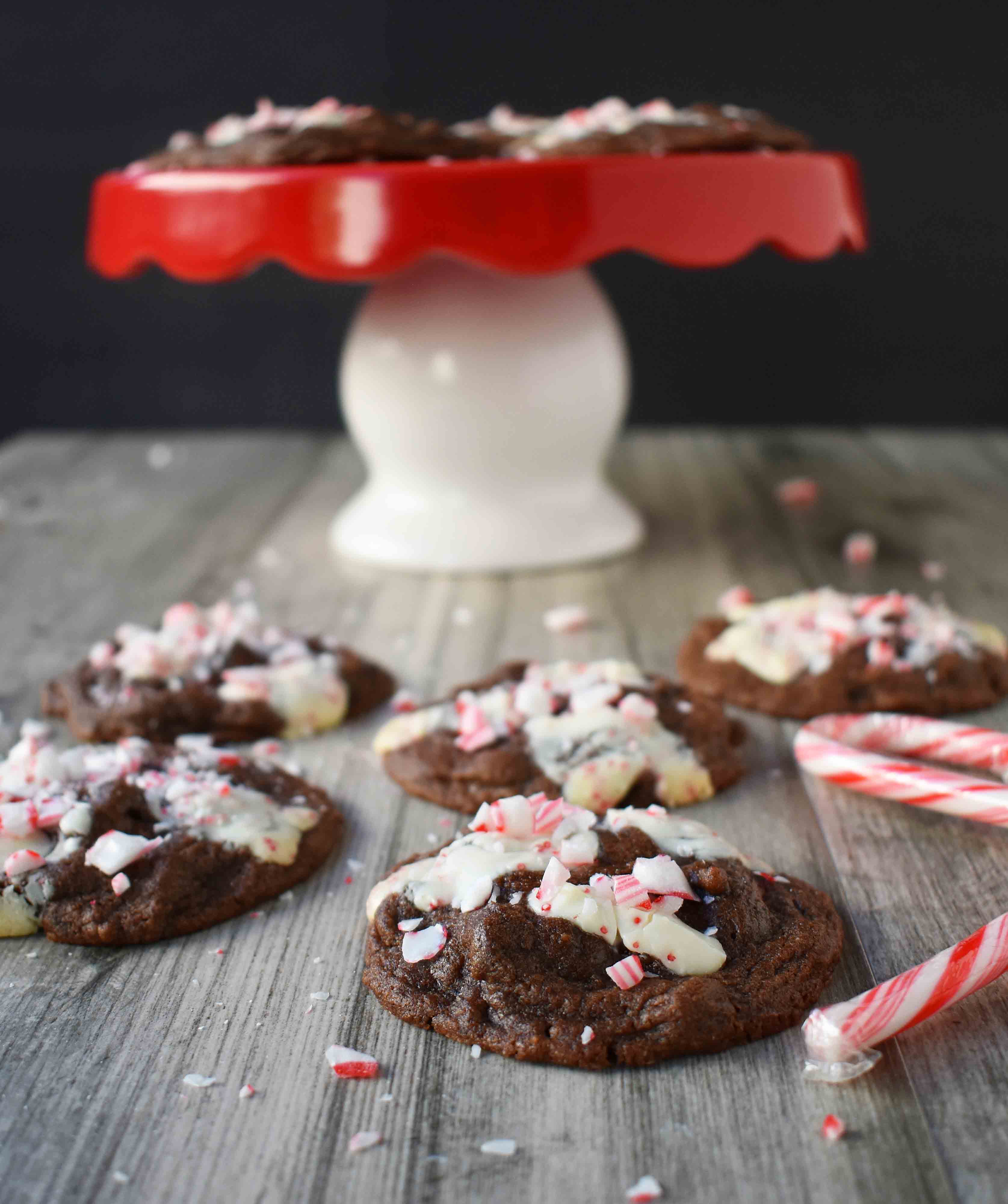 Mrs. Claus Chocolate Peppermint Cookies by Modern Honey. Rich chocolate chunks cookies with peppermint bark and candy canes. The most popular Christmas cookie!