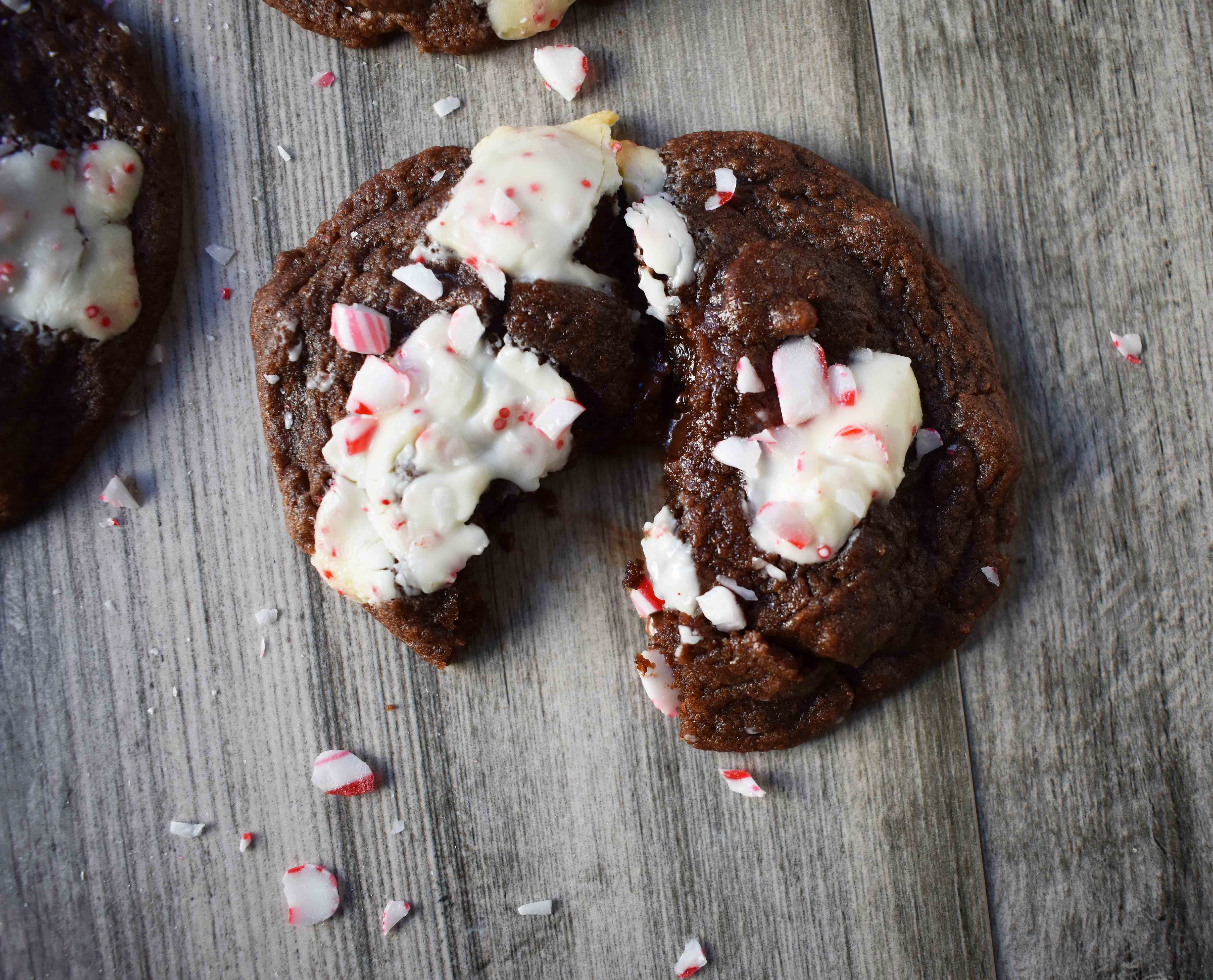 Mrs. Claus Chocolate Peppermint Cookies by Modern Honey. Rich chocolate chunks cookies with peppermint bark and candy canes. The most popular Christmas cookie!