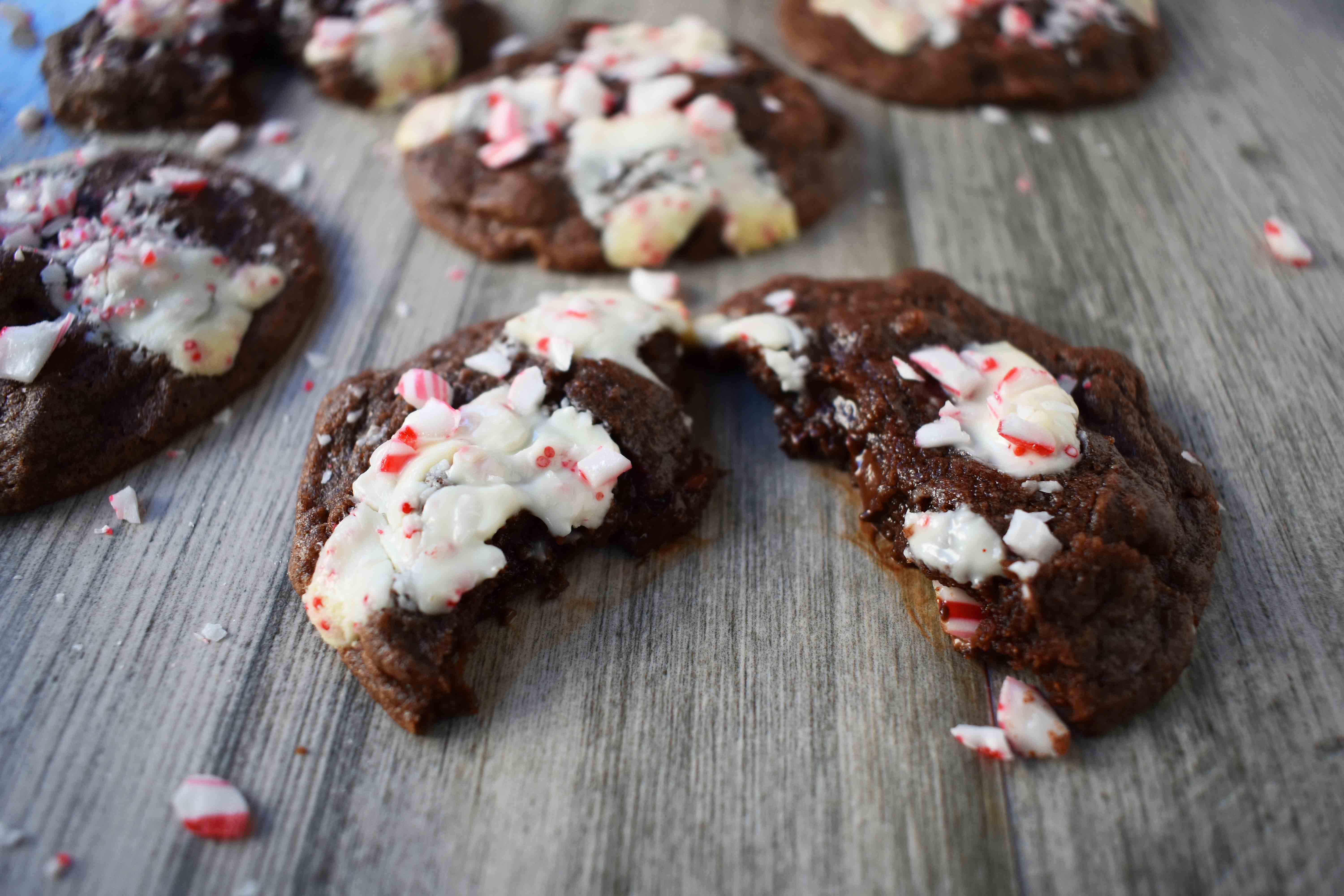 Mrs. Claus Chocolate Peppermint Cookies by Modern Honey. Rich chocolate chunks cookies with peppermint bark and candy canes. The most popular Christmas cookie!