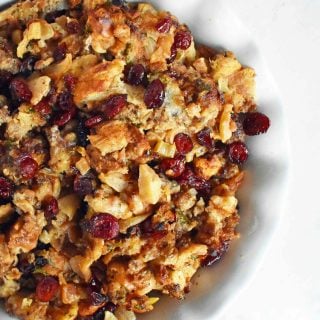Cranberry Apple Sausage Stuffing by Modern Honey. Classic Bread Stuffing with Sausage, Dried Cranberries, and Crisp Apples. The perfect Thanksgiving side dish recipe!
