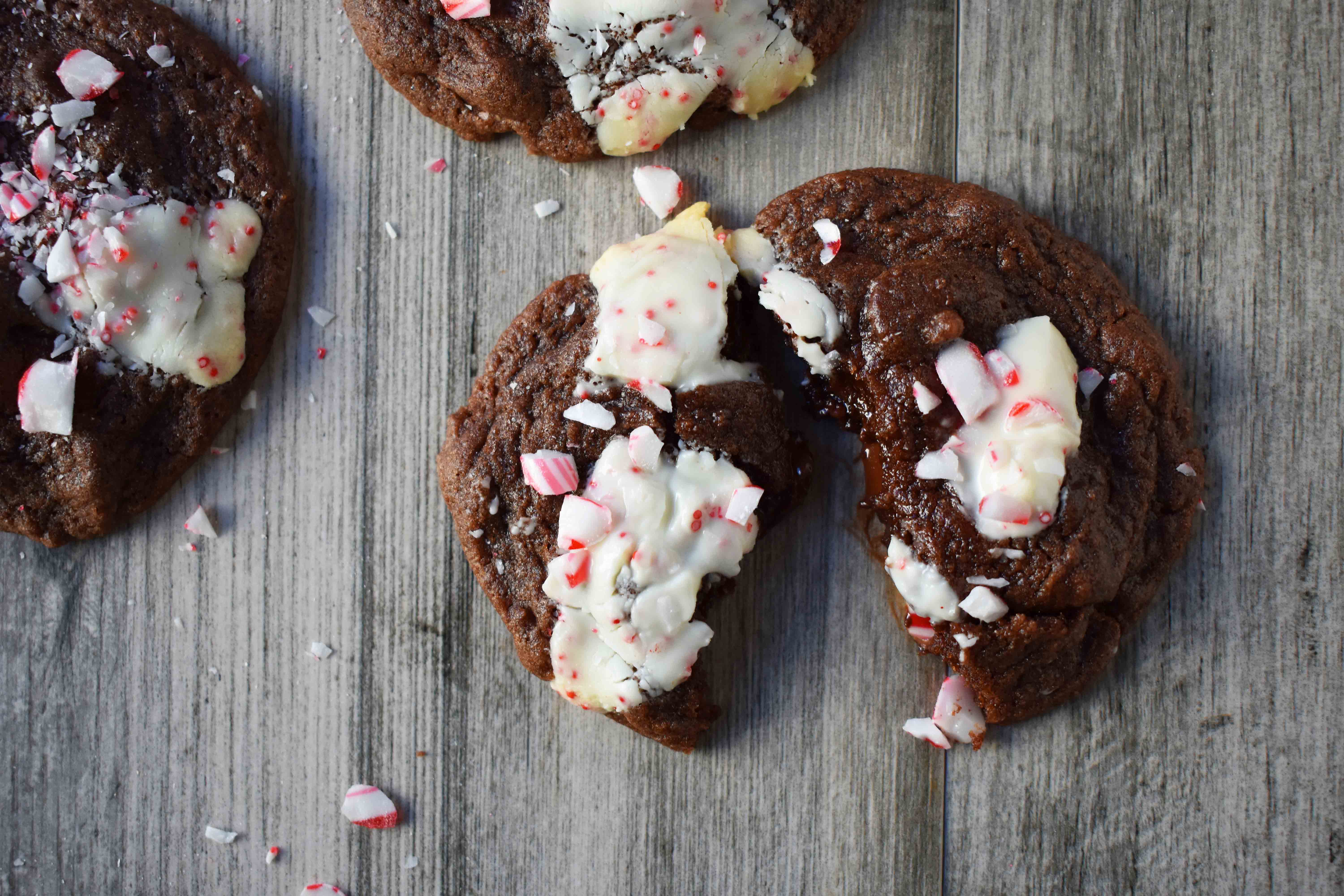 Mrs. Claus Chocolate Peppermint Cookies by Modern Honey. Rich chocolate chunks cookies with peppermint bark and candy canes. The most popular Christmas cookie!