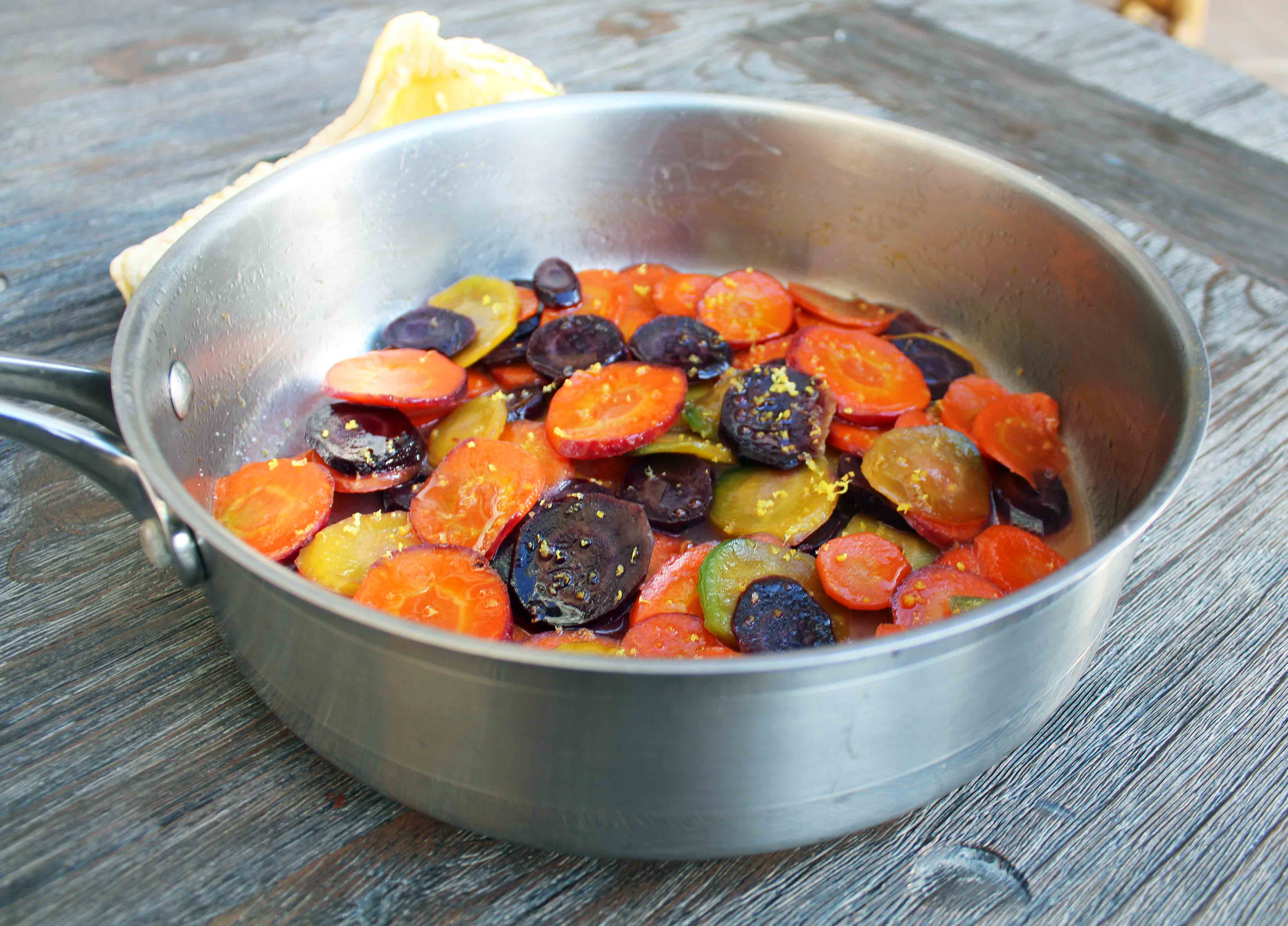 Honey Butter Glazed Carrots by Modern Honey. Heirloom Carrots, Sweet Cream Butter, Creamy Honey, and Lemon Zest make these carrots a real crowd pleaser. A simple but flavorful side dish.